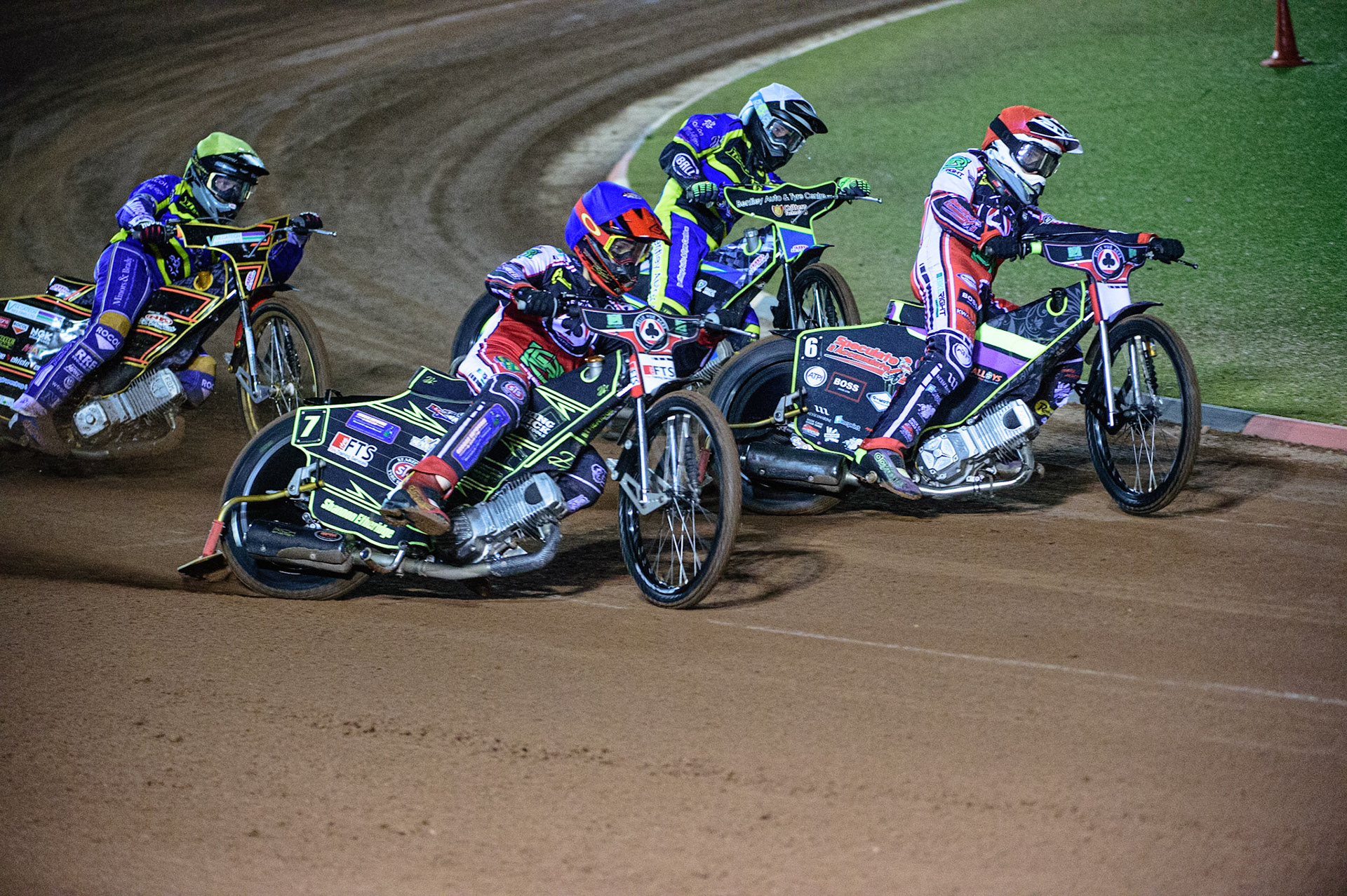 MANCHESTER, UK. OCT 7TH  Jye Etheridge   (Blue) and Tom Brennan  (Red) lead Danyon Hume (White) and Connor Mountain  (Yellow) during the SGB Premiership Play off Semi-Final Second Leg between Belle Vue Aces and Sheffield Tigers at the National Speedway Stadium, Manchester on Thursday 7th October 2021. (Credit: Ian Charles | MI News)