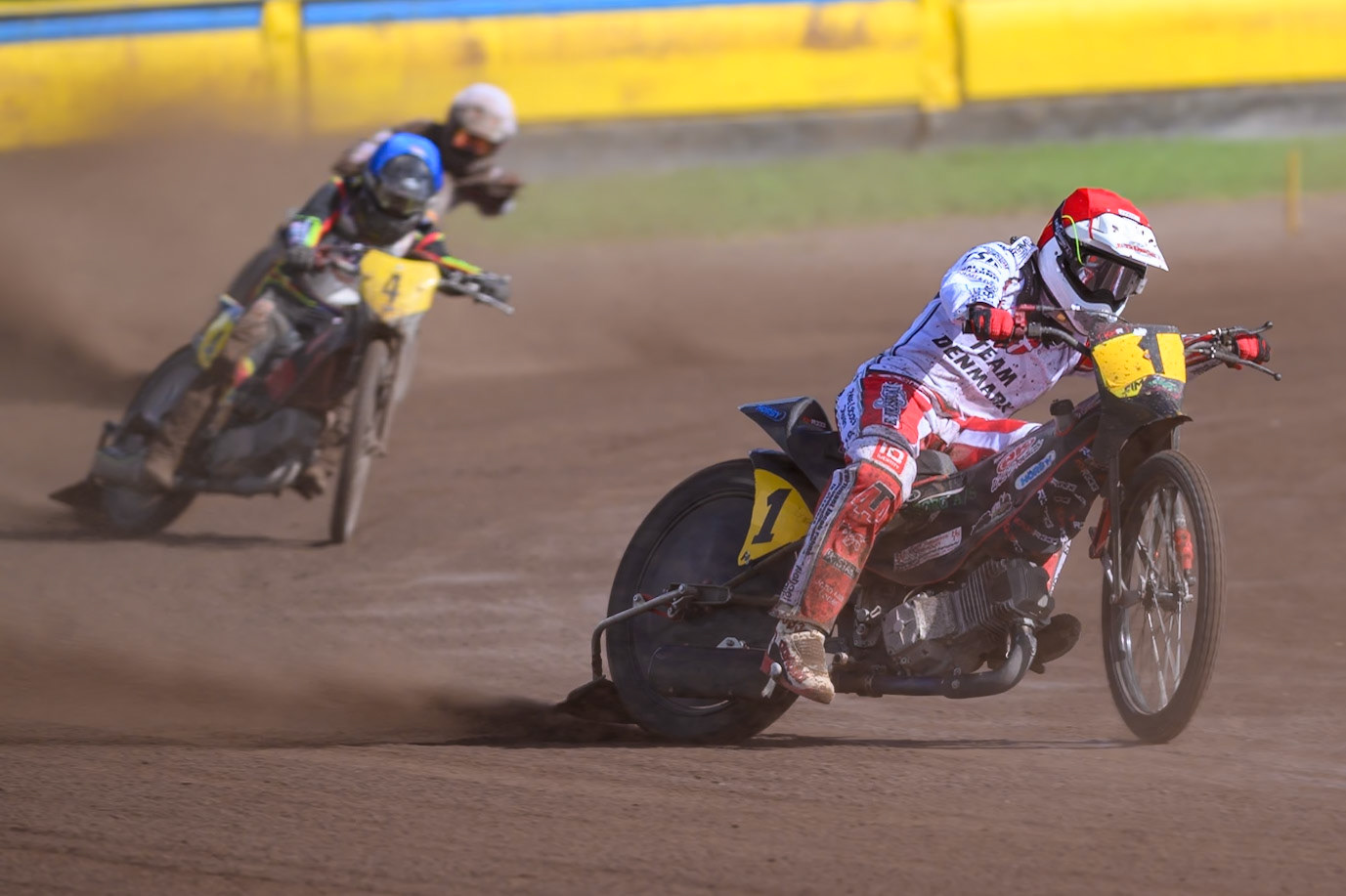 Kenneth Kruse Hansen (1) of Denmark in Red leading Mathias Tresarrieu (4) of France in Blue and \l2\in White during the FIM Long Track of Nations 2026 at the Speed Centre Roden in the Netherlands on Sunday 20th September 2026. (Photo: Ian Charles | MI News)