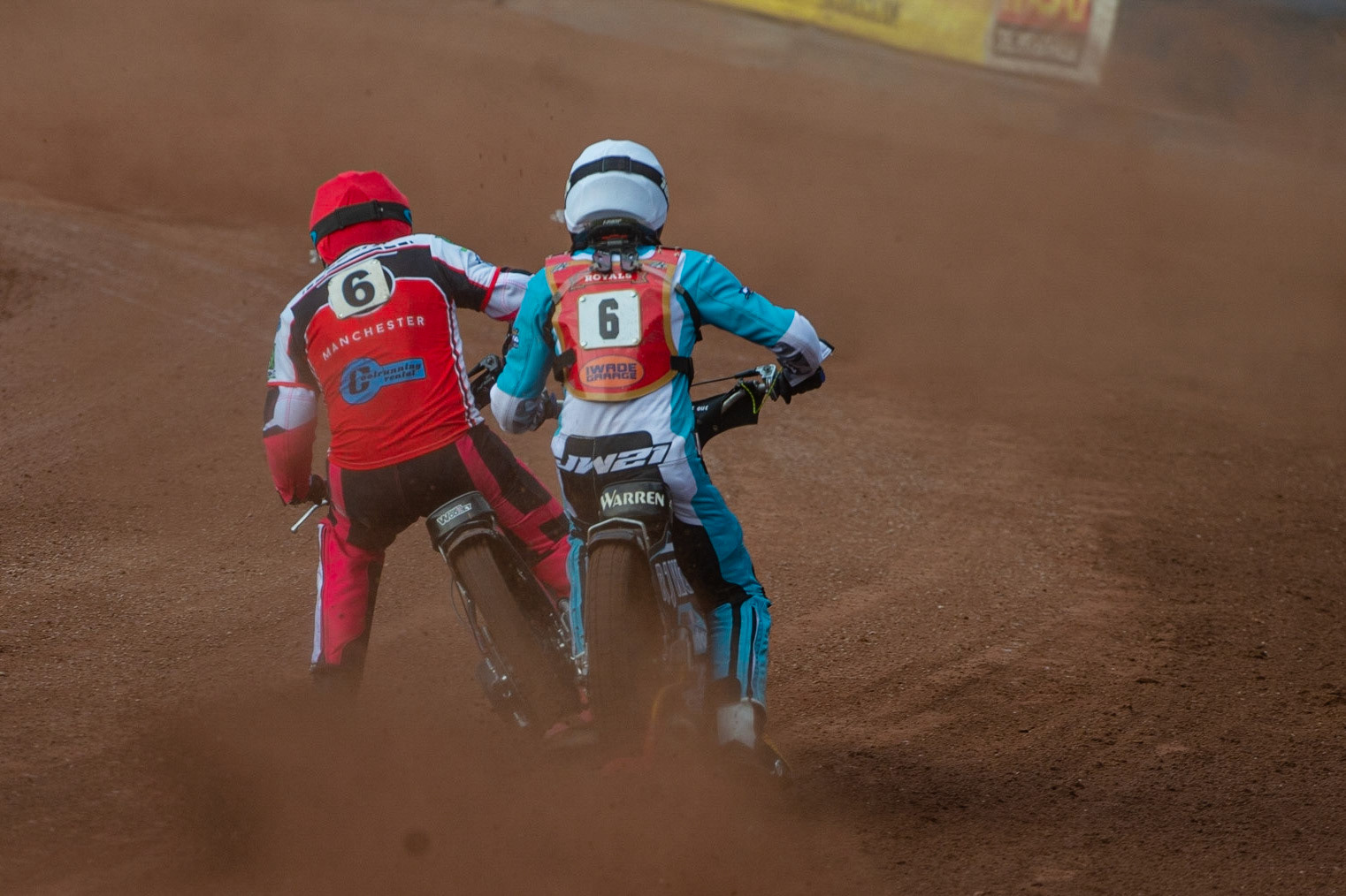 MANCHESTER, UK. JULY 2ND  Sam Woolley  (Red) passes Josh Warren  (White) during the National Development League match between Belle Vue Colts and Kent Royals at the National Speedway Stadium, Manchester on Friday 2nd July 2021. (Credit: Ian Charles | MI News)