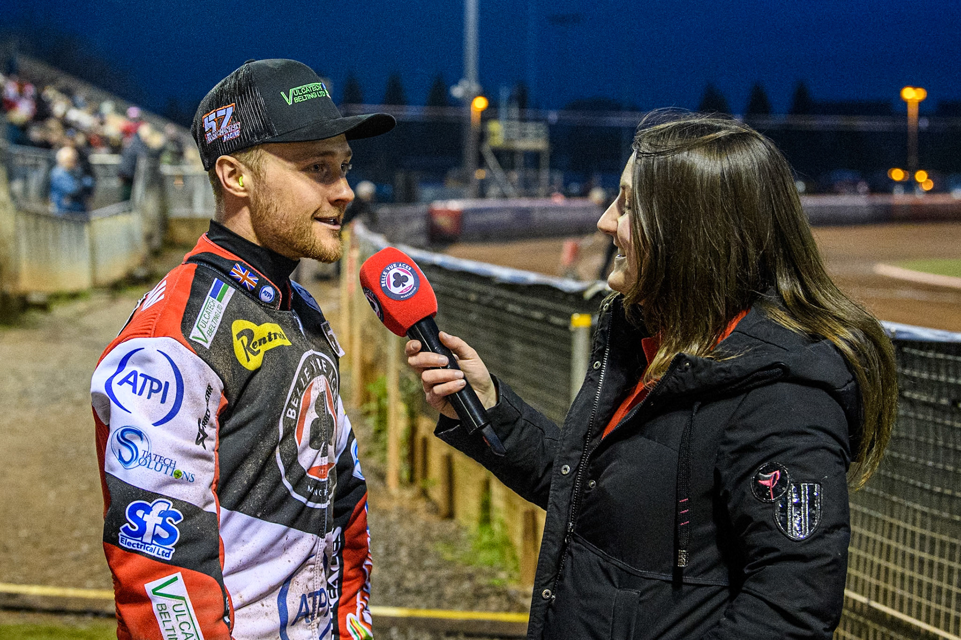 Belle Vue Aces' Connor Mountain (Left) is interviewed by Belle Vue meeting presenter Hayley Bromley during the Rowe Motor Oil Premiership match between Belle Vue Aces and Ipswich Witches at the National Speedway Stadium, Manchester on Monday 22nd April 2024. (Photo: Ian Charles | MI News)