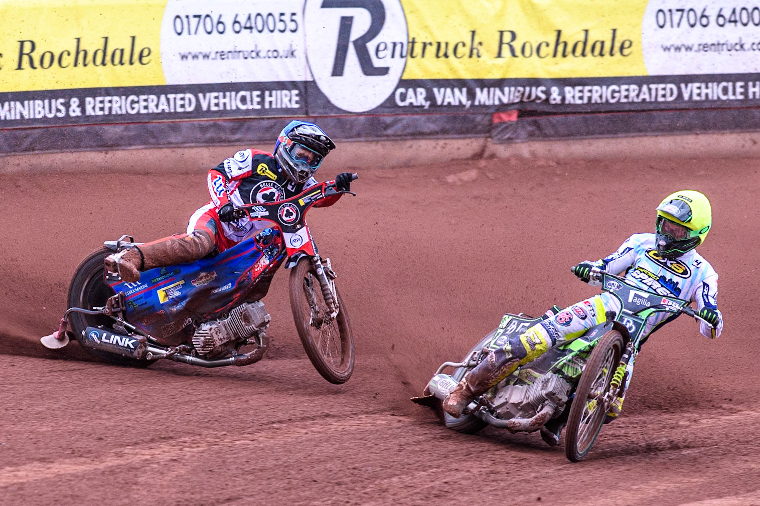 Belle Vue Aces' Ben Cook in Blue loses control after a tangle with Oxford Spires' Charles Wright in Yellow during the Rowe Motor Oil Premiership match between Belle Vue Aces and Oxford Spires at the National Speedway Stadium, Manchester on Monday 22nd July 2024. (Photo: Ian Charles | MI News)