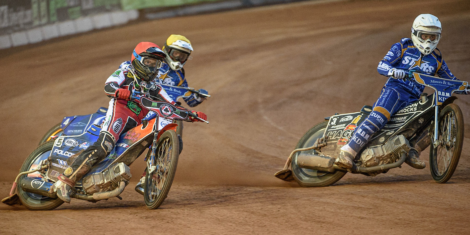 MANCHESTER, UK. AUGUST 23RD    Brady Kurtz  (Red) outside Erik Riss  (White) and Lewis Kerr   (Yellow) during the SGB Premiership match between Belle Vue Aces and King's Lynn Stars at the National Speedway Stadium, Manchester on Monday 23rd August 2021. (Credit: Ian Charles | MI News)
