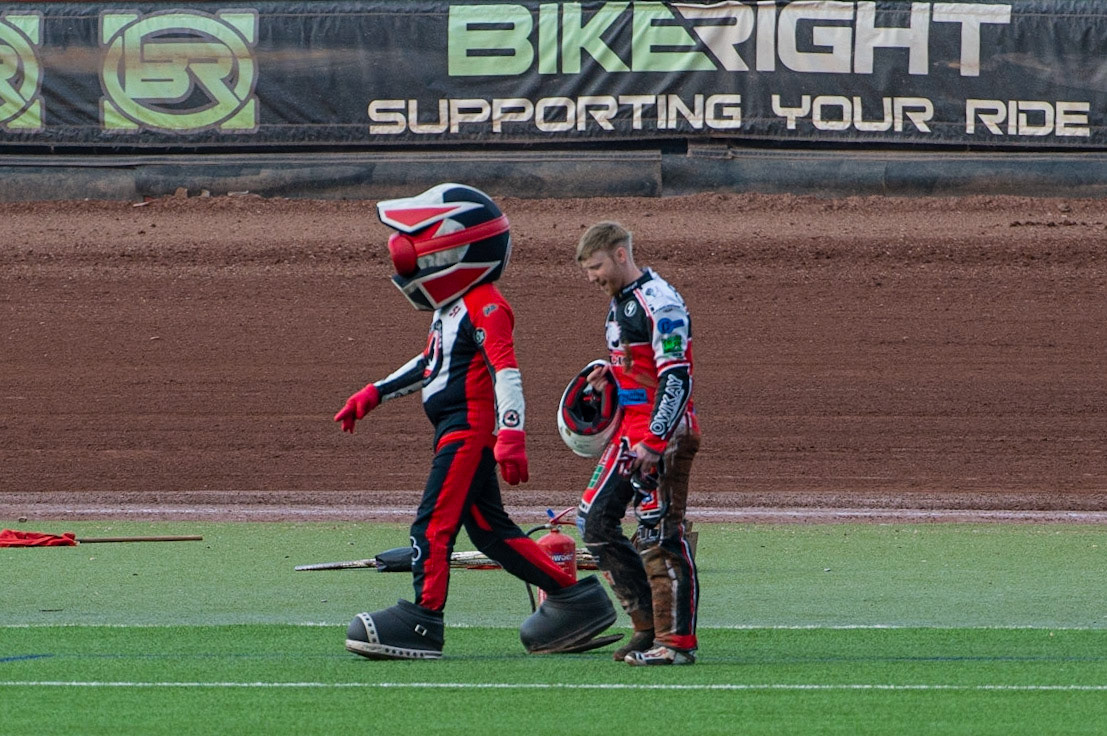 MANCHESTER, UK. JULY 2ND  Paul Bowen  walks back to the pits with Mascot Chase The Ace after his fall during the National Development League match between Belle Vue Colts and Kent Royals at the National Speedway Stadium, Manchester on Friday 2nd July 2021. (Credit: Ian Charles | MI News)