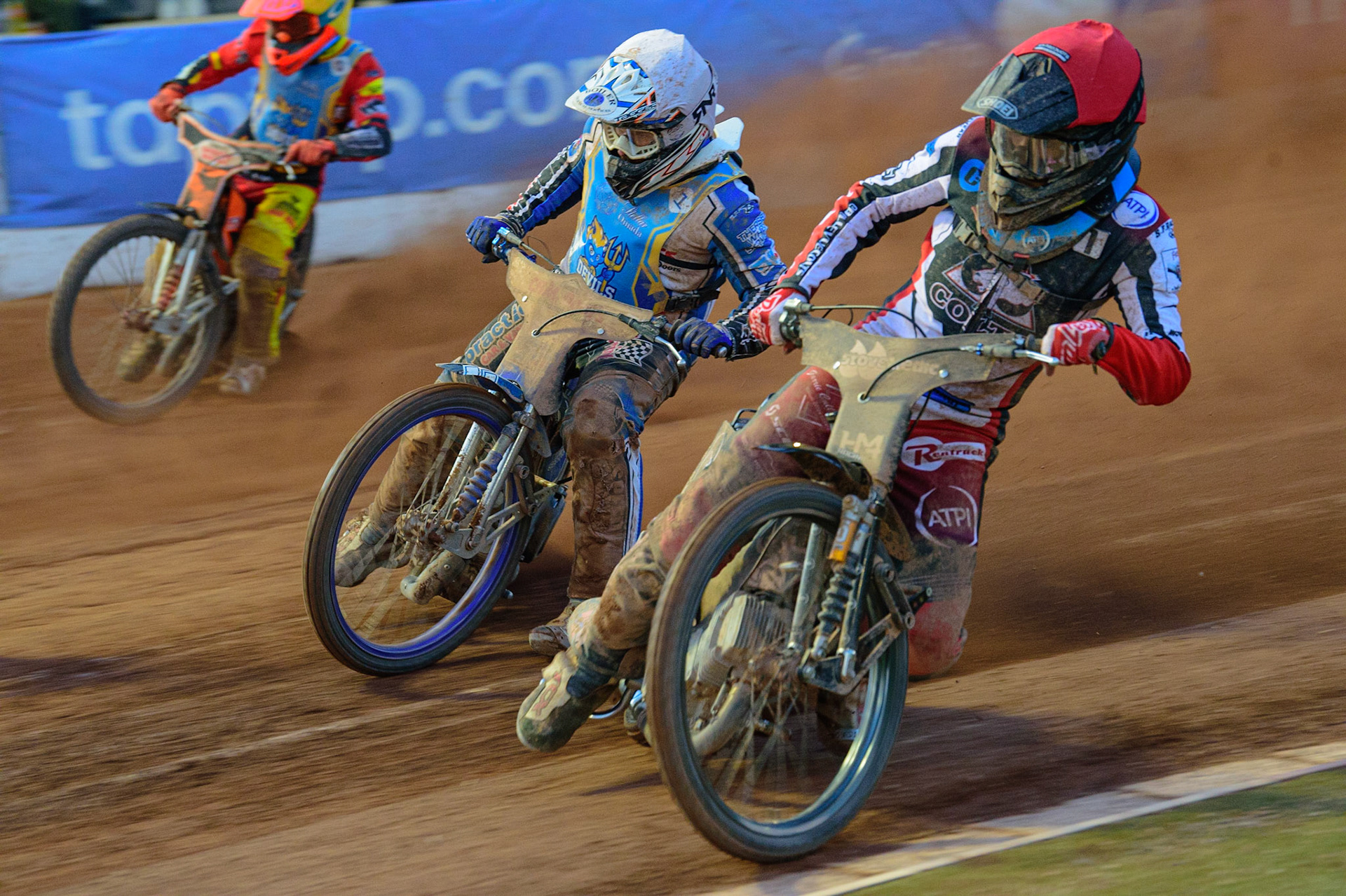 MANCHESTER, UK. MAY 27TH  Harry McGurk  (Red) forces his way past Danny Phillips   (White) with Connor Coles (Yellow) on the outside during the National Development League match between Belle Vue Colts and Armadale Devils at the National Speedway Stadium, Manchester on Friday 27th May 2022. (Credit: Ian Charles | MI News)
