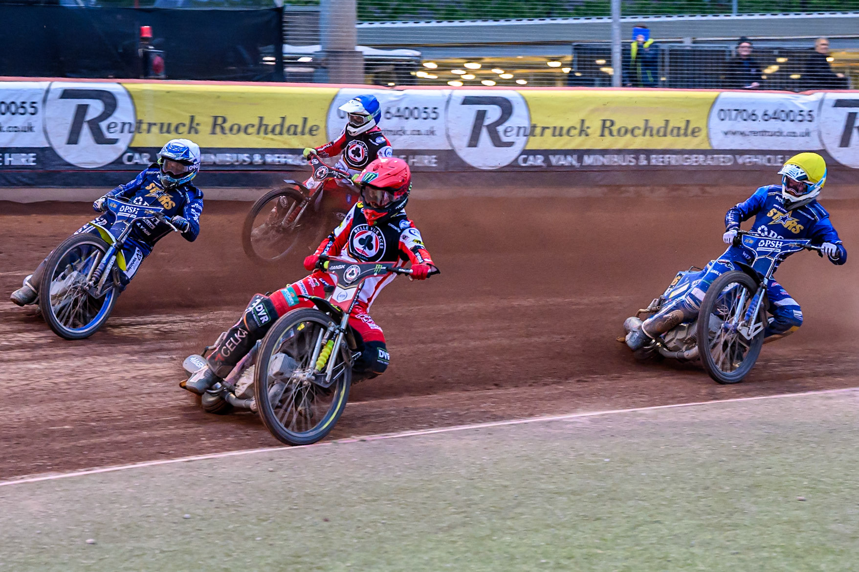 Belle Vue Aces' Jaimon Lidsey rides inside Kings Lynn Stars' Chris Harris in White with Belle Vue Aces' Jake Mulford in Blue and Kings Lynn Stars' Guest Rider, Anders Rowe in Yellow behind during the Rowe Motor Oil Premiership match between Belle Vue Aces and King's Lynn Stars at the National Speedway Stadium, Manchester on Monday 23rd June 2025. (Photo: Ian Charles | MI News)