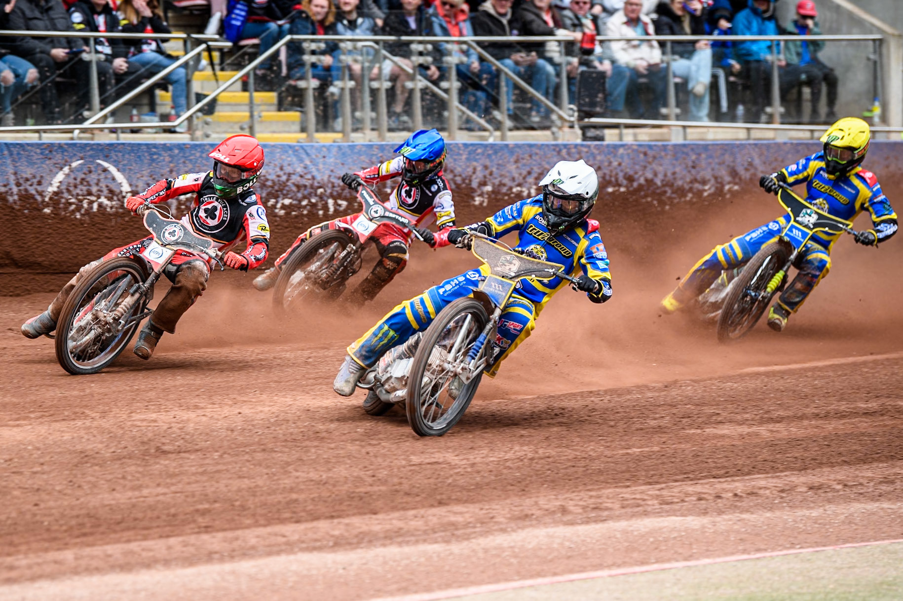 Jack Holder of Sheffield Tigers in White leading Brady Kurtz of Belle Vue Aces in Red, Dan Bewley of Belle Vue Aces in Blue and Chris Holder of Sheffield Tigers  in Yellow during the Rowe Motor Oil Premiership match between Belle Vue Aces and Sheffield Tigers at the National Speedway Stadium, Manchester on Monday 5th May 2025. (Photo: Ian Charles | MI News)
