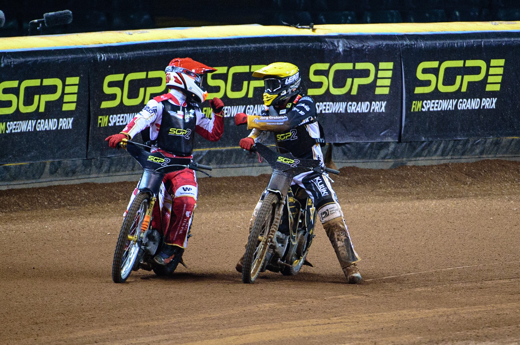 Norick Blodorn (Germany)  (Yellow) congratulates Mateusz Cierniak (Poland)  (Red) on his heat win during the FIM  Speedway Grand Prix  2 of Great Britain at the Principality Stadium, Cardiff on Sunday 14th August 2022. (Credit: Ian Charles | MI News)