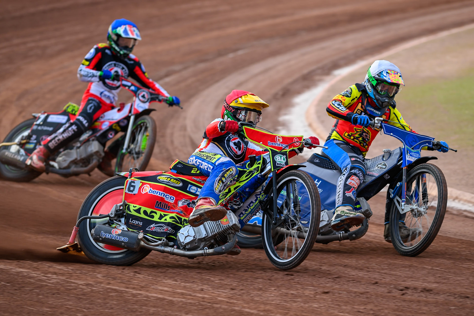 Mitch McDiarmid, Guest Rider for Belle Vue Aces in Red rides outside Jonas Jeppesen Guest rider for Leicester Lions in White  with \William Cairns of Belle Vue Aces in Blue behind during the Rowe Motor Oil Premiership match between Belle Vue Aces and Leicester Lions at the National Speedway Stadium, Manchester on Monday 3rd August 2026. (Photo: Ian Charles | MI News)