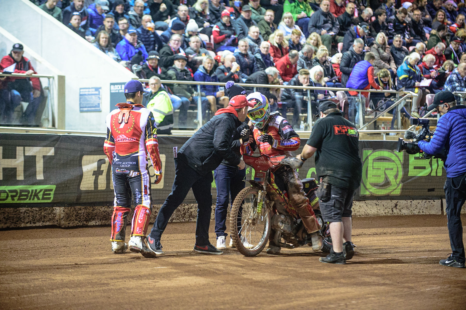 MANCHESTER, UK. OCT 11TH  Panthers riders and staff congratulate Michael Palm Toft  on his ride during the SGB Premiership Grand Final 1st Leg between Belle Vue Aces and Peterborough Panthers at the National Speedway Stadium, Manchester on Monday 11th October 2021. (Credit: Ian Charles | MI News)