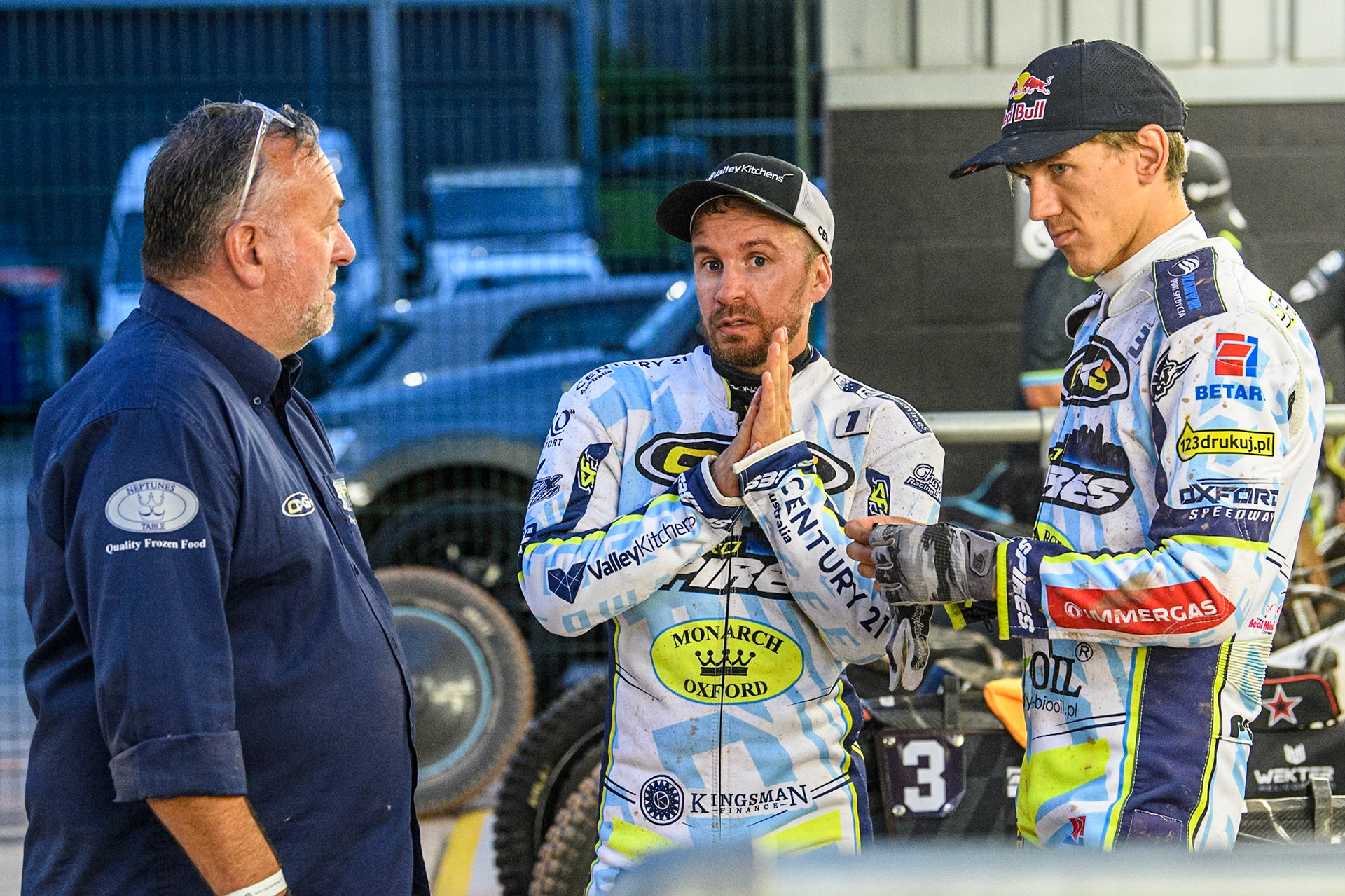 Oxford Spires' Team Manager Peter Schroek (Left) with Oxford Spires' Rohan Tungate  (Centre) and Oxford Spires' Maciej Janowski  (Right) during the Rowe Motor Oil Premiership match between Belle Vue Aces and Oxford Spires at the National Speedway Stadium, Manchester on Monday 22nd July 2024. (Photo: Ian Charles | MI News)