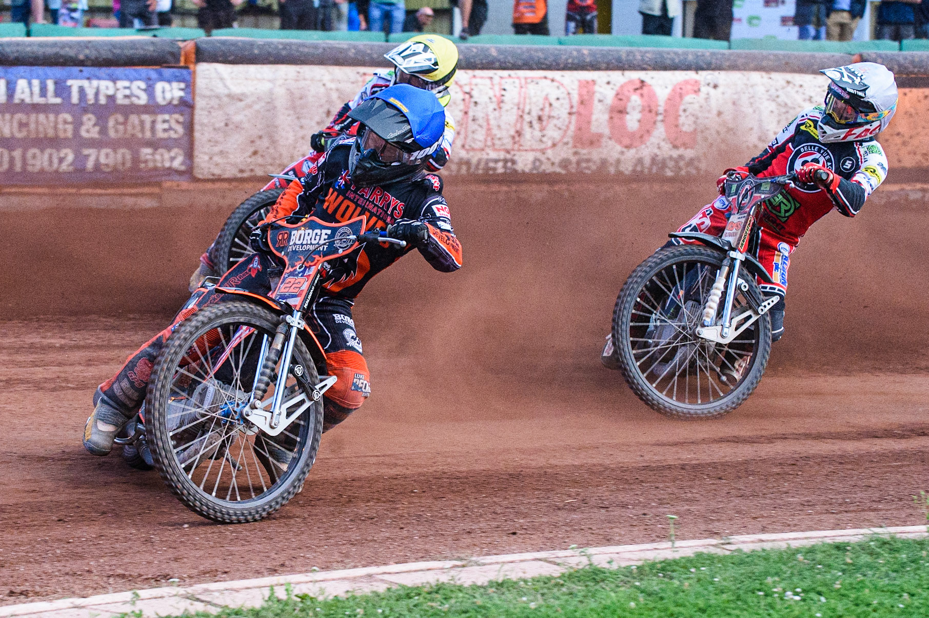 WOLVERHAMPTON, UK. JULY 26TH  Luke Becker  (Blue) leads Dan Bewley  (White) and Tom Brennan  (Yellow) during the SGB Premiership match between Wolverhampton Wolves and Belle Vue Aces at the Ladbroke Stadium, Wolverhampton on Monday 26th July 2021. (Credit: Ian Charles | MI News)