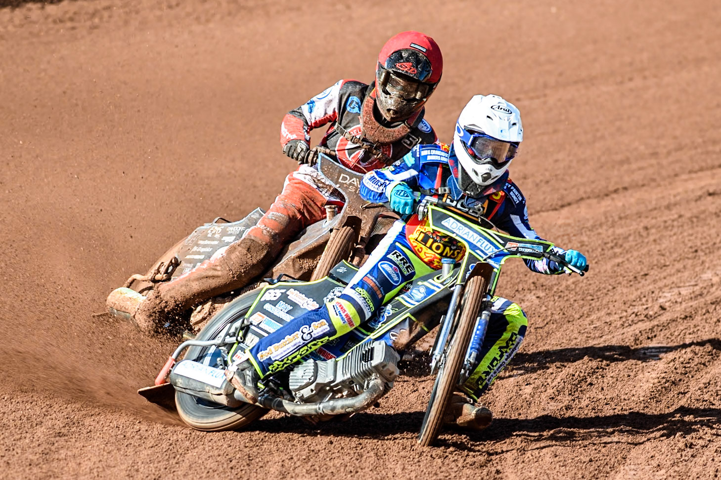 Leicester Lion Cubs' Jody Scott (White) leads  Belle Vue Colts' Freddy Hodder (Red) during the WSRA  National Development League match between Belle Vue Colts and Leicester Lion Cubs at the National Speedway Stadium, Manchester on Friday 29th March 2024. (Photo: Ian Charles | MI News)