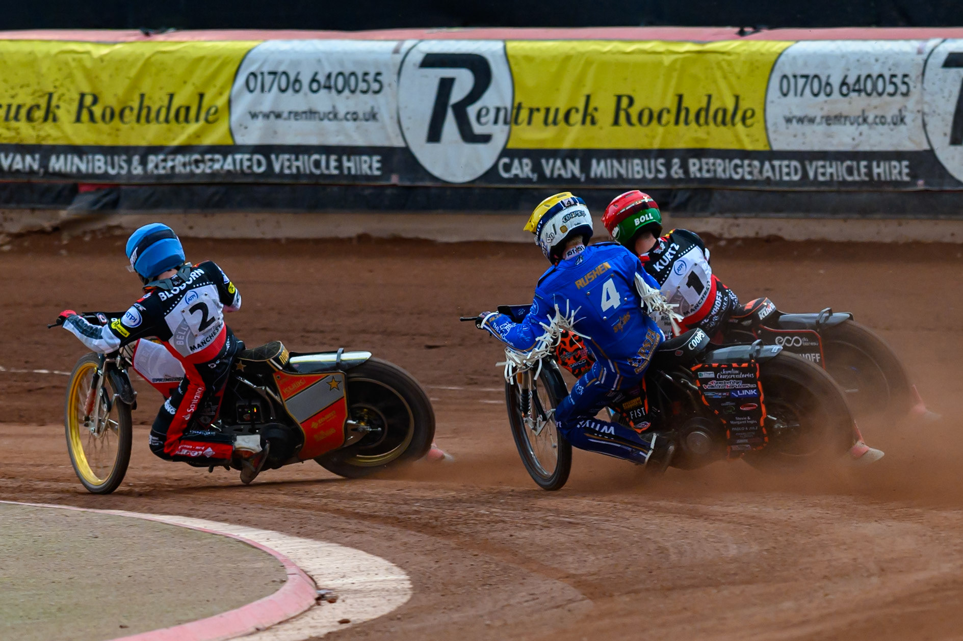 Cooper Rushen of Kings Lynn Stars in Yellow chases Brady Kurtz of Belle Vue Aces in Red and Norick Blödorn of Belle Vue Aces in Blue during the Rowe Motor Oil Premiership match between Belle Vue Aces and King's Lynn Stars at the National Speedway Stadium, Manchester on Monday 29th June 2026. (Photo: Ian Charles | MI News)