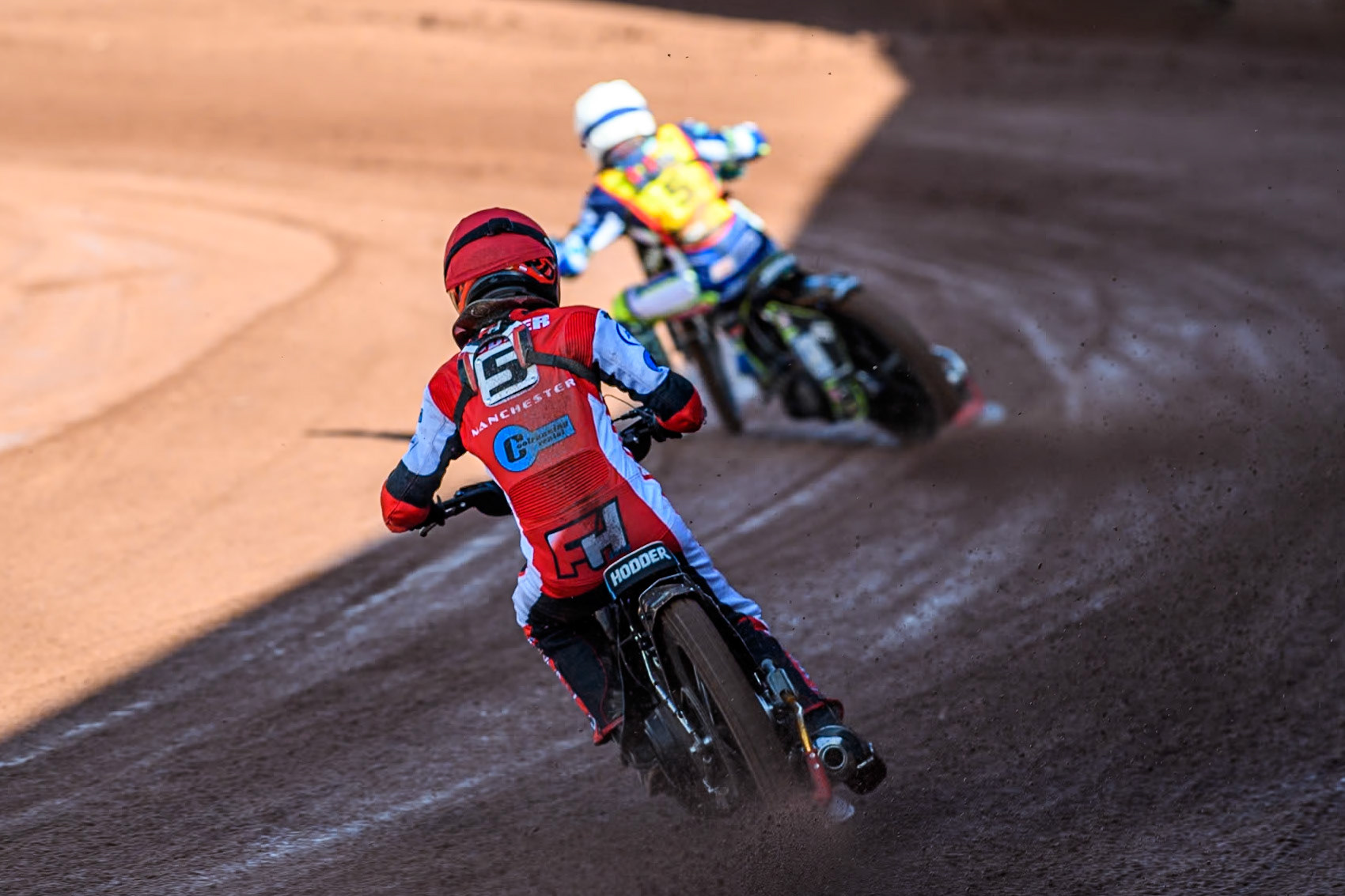 Belle Vue Colts' Freddy Hodder (Red) chases Leicester Lion Cubs' Jody Scott (White) during the WSRA  National Development League match between Belle Vue Colts and Leicester Lion Cubs at the National Speedway Stadium, Manchester on Friday 29th March 2024. (Photo: Ian Charles | MI News)