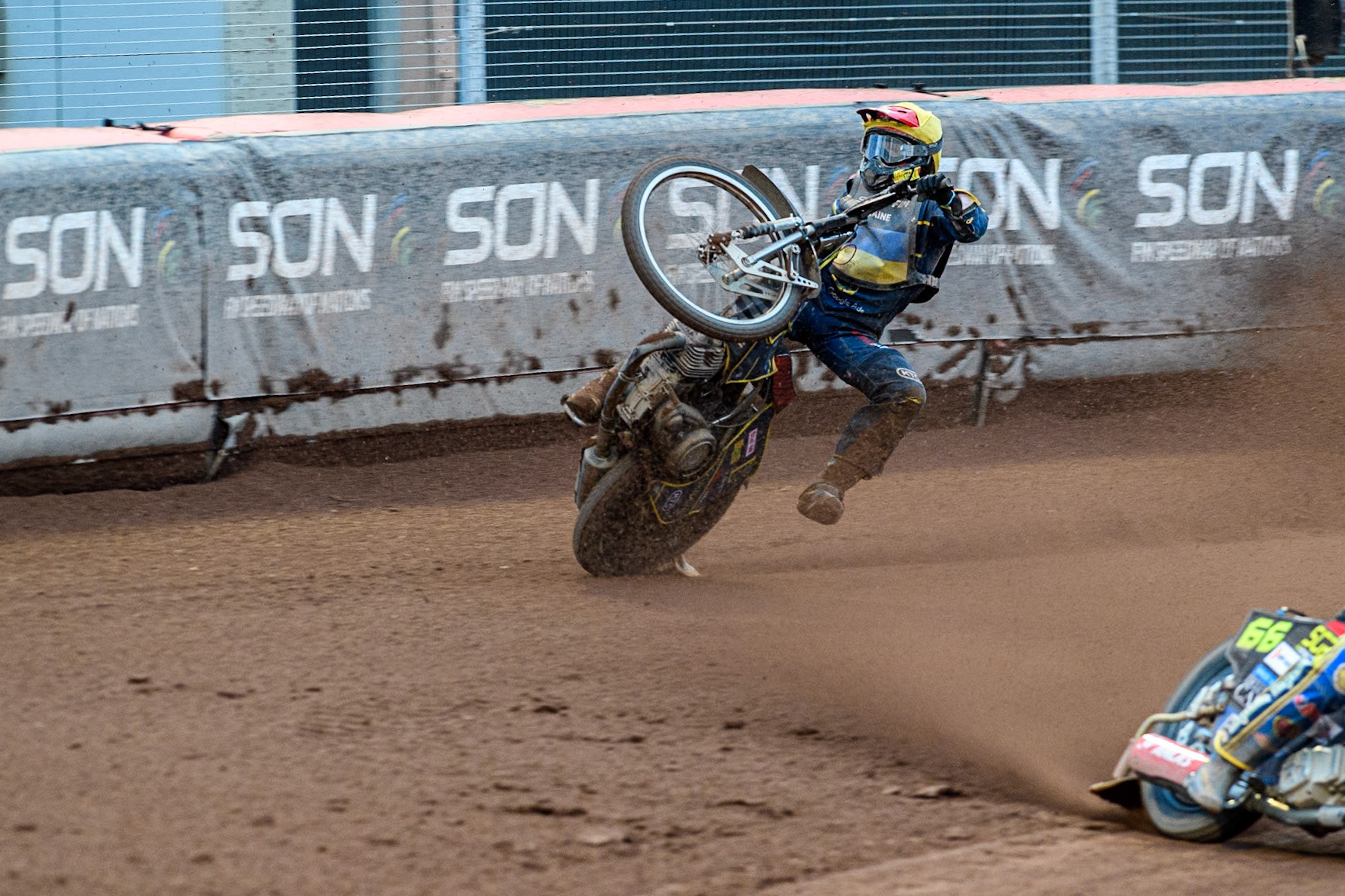 Marko Levishyn of Ukraine in Yellow crashes out of his final heat during the Monster Energy FIM Speedway of Nations Semi-Final 1 at the National Speedway Stadium, Manchester on Tuesday 9th July 2024. (Photo: Ian Charles | MI News)