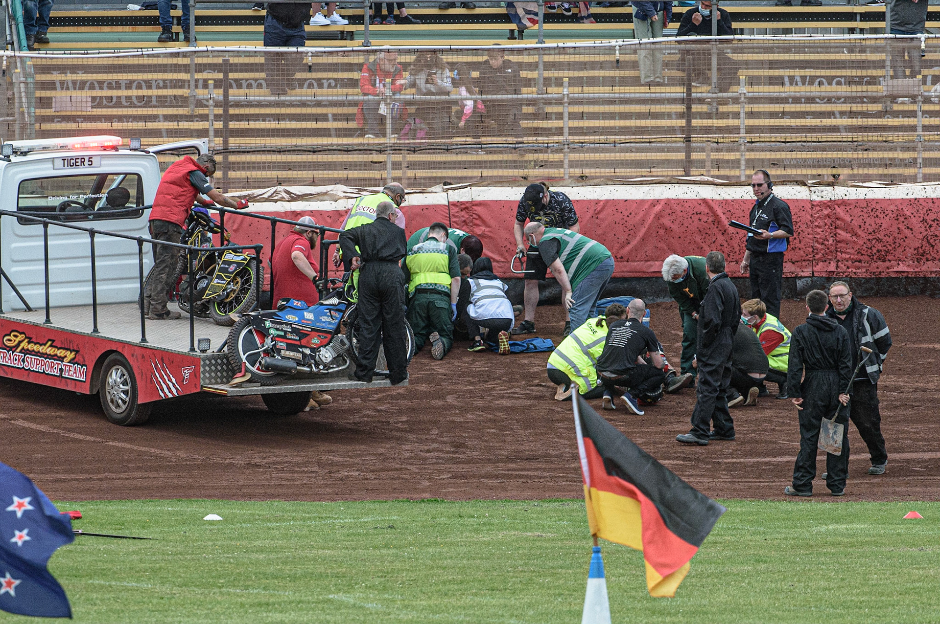 GLASGOW, UK. JUNE 19TH.  Medical staff attend to the fallen riders Bradley Dean-Wilson (New Zealand) and Tero Aarnio (Finland) during the FIM Speedway Grand Prix Qualifying Round at the Peugeot Ashfield Stadium, Glasgow on Saturday 19th June 2021. (Credit: Ian Charles | MI News)