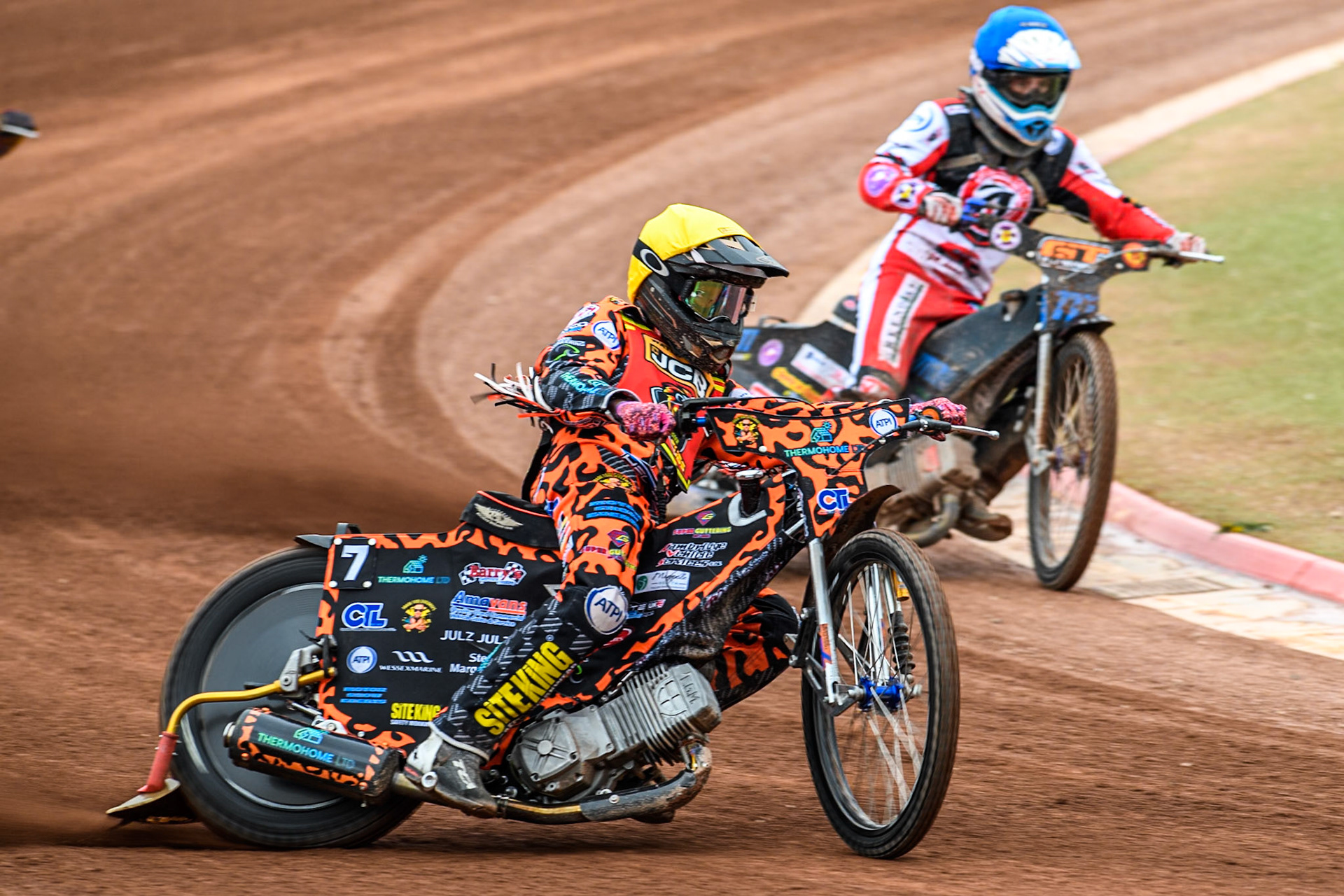 Leicester Lion Cubs' Cooper Rushen in Yellow leading Belle Vue Colts' Billy Budd in Blue during the WSRA National Development League match between Belle Vue Colts and Leicester Lion Cubs at the National Speedway Stadium, Manchester on Friday 18th April 2025. (Photo: Ian Charles | MI News)