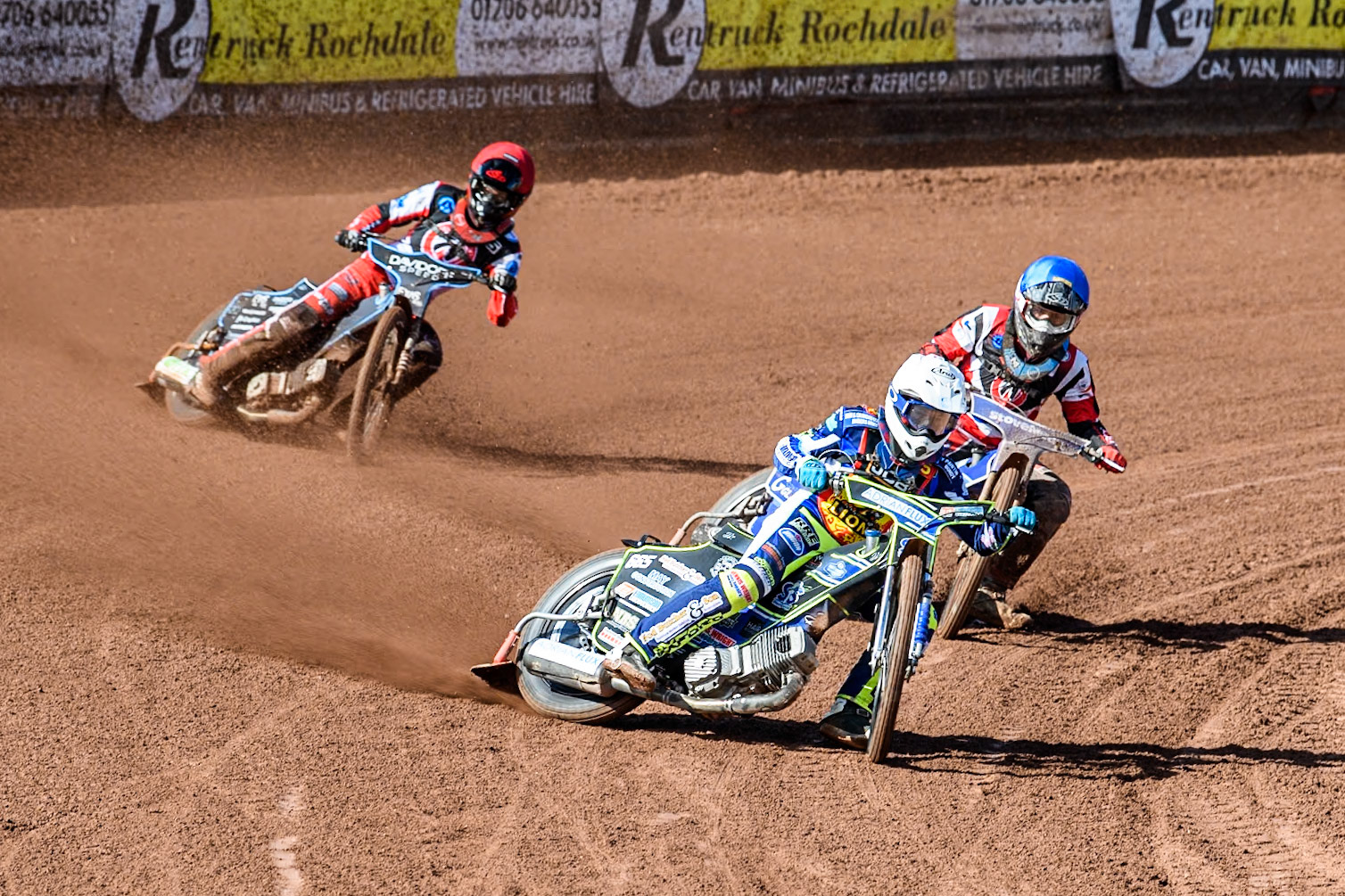 Leicester Lion Cubs' Jody Scott (White) leads  Belle Vue Colts' Harry McGurk (Blue) and Belle Vue Colts' Freddy Hodder (Red) during the WSRA National Development League match between Belle Vue Colts and Leicester Lion Cubs at the National Speedway Stadium, Manchester on Friday 29th March 2024. (Photo: Ian Charles | MI News)