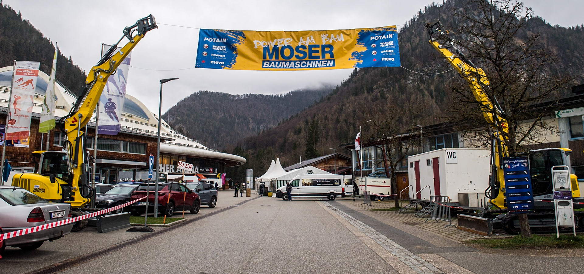 One of the partner sponsors of the meeting used some of  their equipment to hold up the advertising banner during the FIM Ice Speedway Gladiators World Championship Final 1 at the Max-Aicher-Arena, Inzell on Saturday 23 March 2024. (Photo: Ian Charles | MI News)