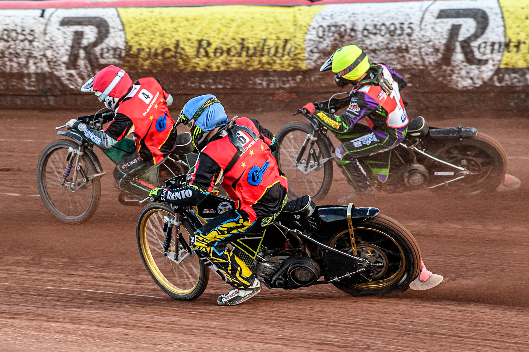 Belle Vue Colts' Guest rider Keiran Douglas in Blue chases Middlesbrough Tigers' Kai Ward in Yellow and Belle Vue Colts' Guest rider Mason Watson in Red during the WSRA National Development League match between Belle Vue Colts and Middlesbrough Tigers at the National Speedway Stadium, Manchester on Monday 17th June 2024. (Photo: Ian Charles | MI News)