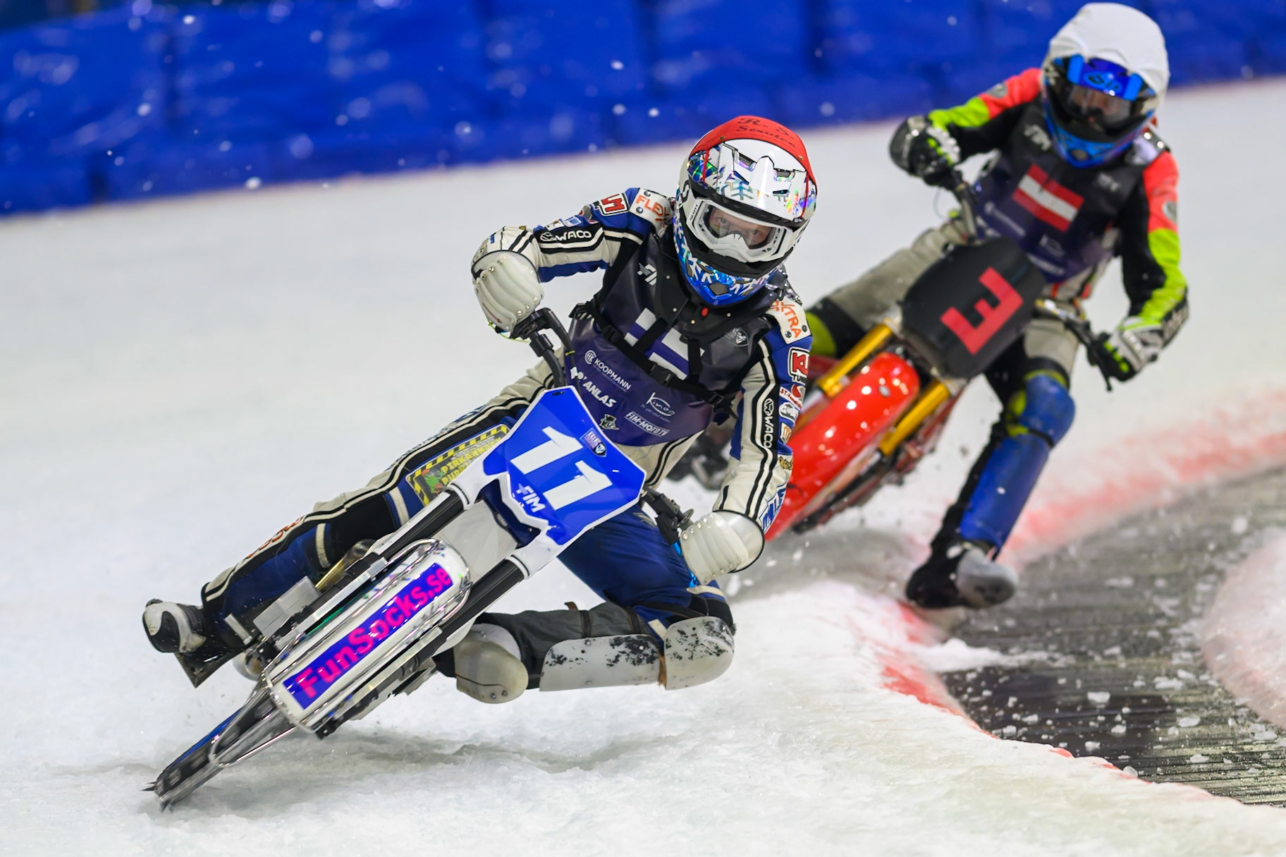 Max Koivula (11) of Finland  in Red leading Harald Simon (3) of Austria  in White during the FIM Ice Speedway Of Nations at Ice Rink Thialf, Heerenveen on Sunday 12th April 2026. (Photo: Ian Charles | MI News)