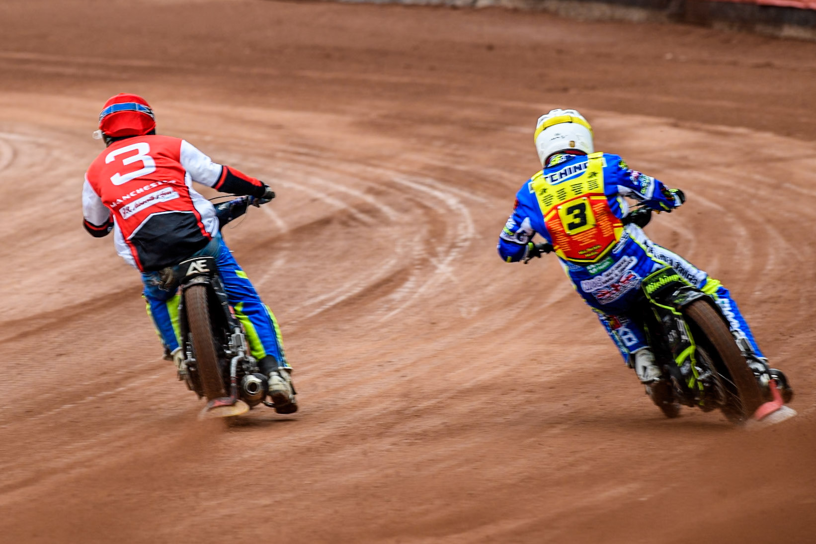 Belle Vue Colts' Jack Kingston in Red leading Leicester Lion Cubs' Guest Rider Darryl Ritchings in White during the WSRA National Development League match between Belle Vue Colts and Leicester Lion Cubs at the National Speedway Stadium, Manchester on Friday 18th April 2025. (Photo: Ian Charles | MI News)