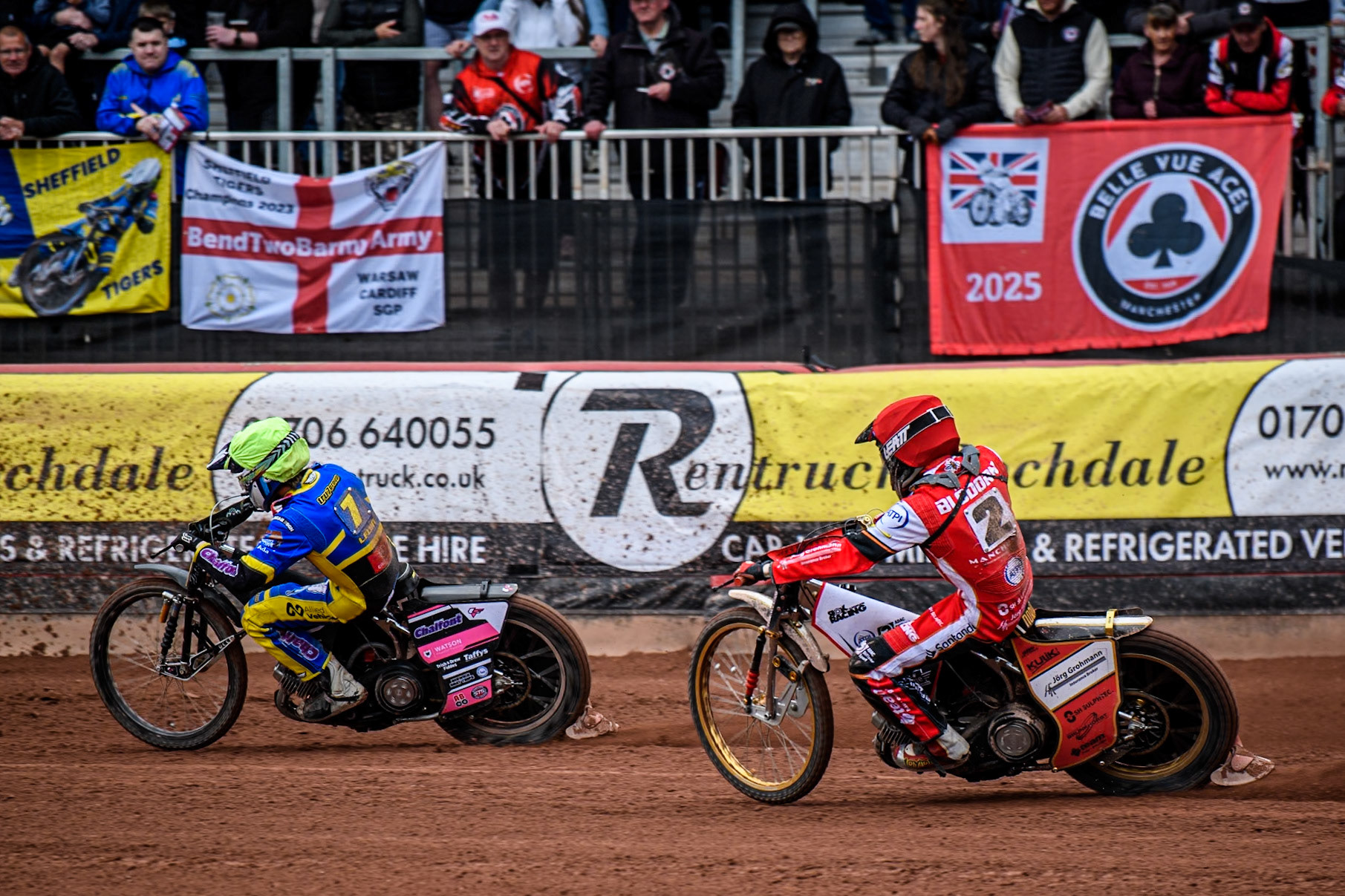 Norick Blödorn of Belle Vue Aces in Red chases Leon Flint of Sheffield Tigers in Yellow during the Rowe Motor Oil Premiership match between Belle Vue Aces and Sheffield Tigers at the National Speedway Stadium, Manchester on Monday 5th May 2025. (Photo: Ian Charles | MI News)