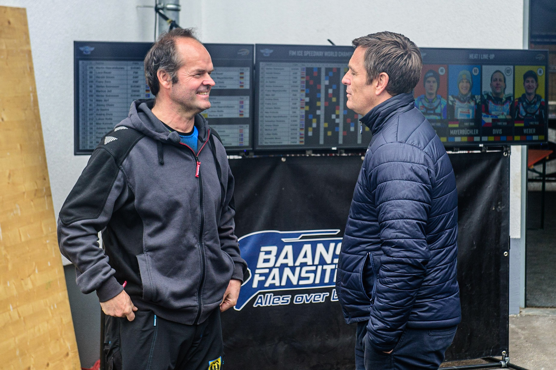 Gunther Bauer (left) chats with FIM Race Director Phil Morris