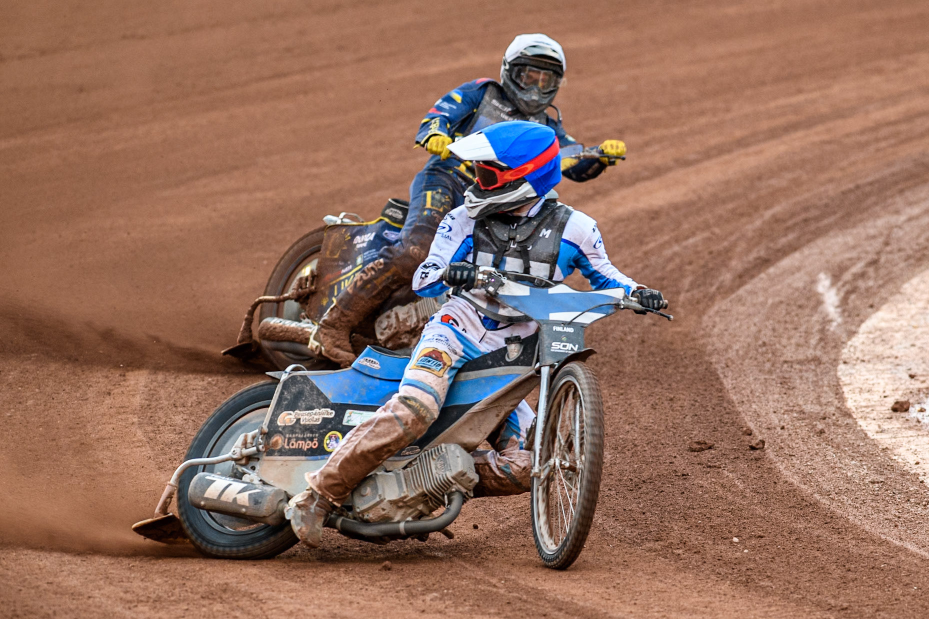 Antti Vuolas of Finland in Blue leading Stanislav Melnychuk of Ukraine in White during the Monster Energy FIM Speedway of Nations Semi-Final 1 at the National Speedway Stadium, Manchester on Tuesday 9th July 2024. (Photo: Ian Charles | MI News)