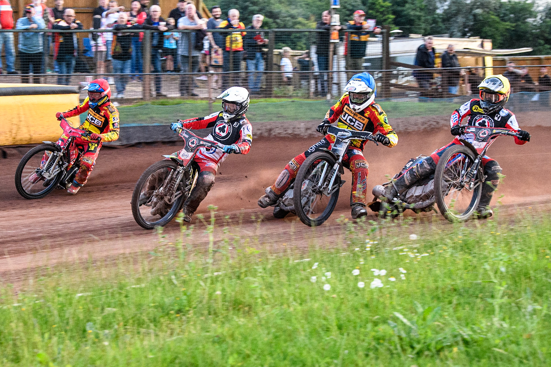 Belle Vue Aces' Jaimon Lidsey in White leading Leicester Lions' Max Fricke in Red, Leicester Lions' Richard Lawson in Blue and Belle Vue Aces' Ben Cook in Yellow during the Rowe Motor Oil Premiership match between Leicester Lions and Belle Vue Aces at the Pidcock Motorcycles Arena, Leicester on Thursday 25th July 2024. (Photo: Ian Charles | MI News)