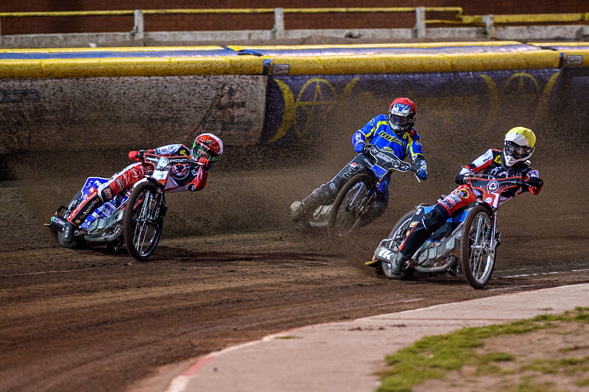Belle Vue Aces' Dan Bewley  in White and Belle Vue Aces' Antti Vuolas  in Yellow leading Sheffield Tigers' Guest Rider Chris Harris  in Red during the Rowe Motor Oil Premiership Play Off Semi Final 2nd leg between Sheffield Tigers and Belle Vue Aces at Owlerton Stadium, Sheffield on Thursday 19th September 2024. (Photo: Ian Charles | MI News)