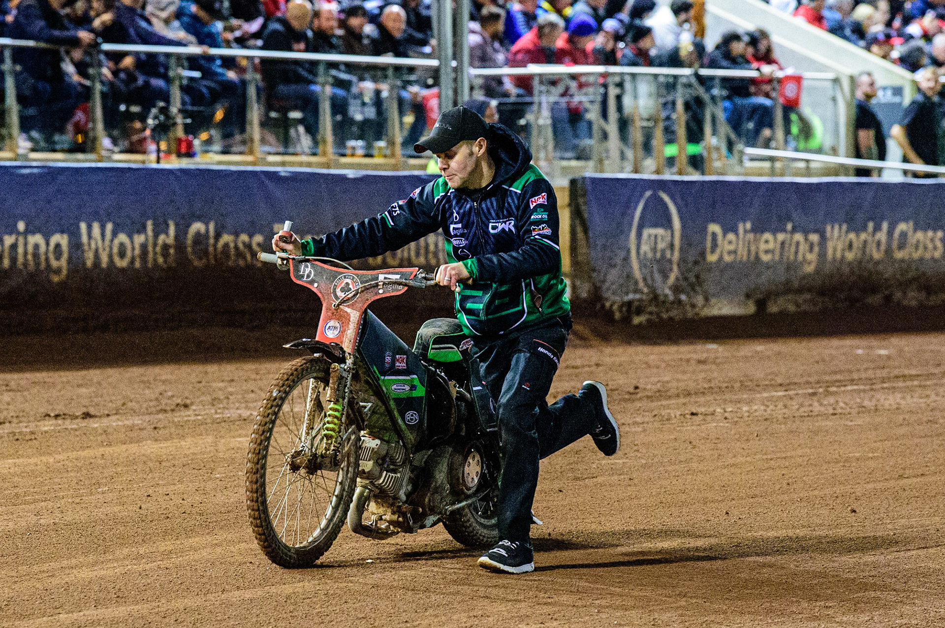 Mechanic Andy Mellish pushes Charles Wright’s bike back after his fall during the SGB Premiership Grand Final 1st leg between Belle Vue Aces and Sheffield Tigers at the National Speedway Stadium, Manchester on Monday 10th October 2022. (Credit: Ian Charles | MI News)