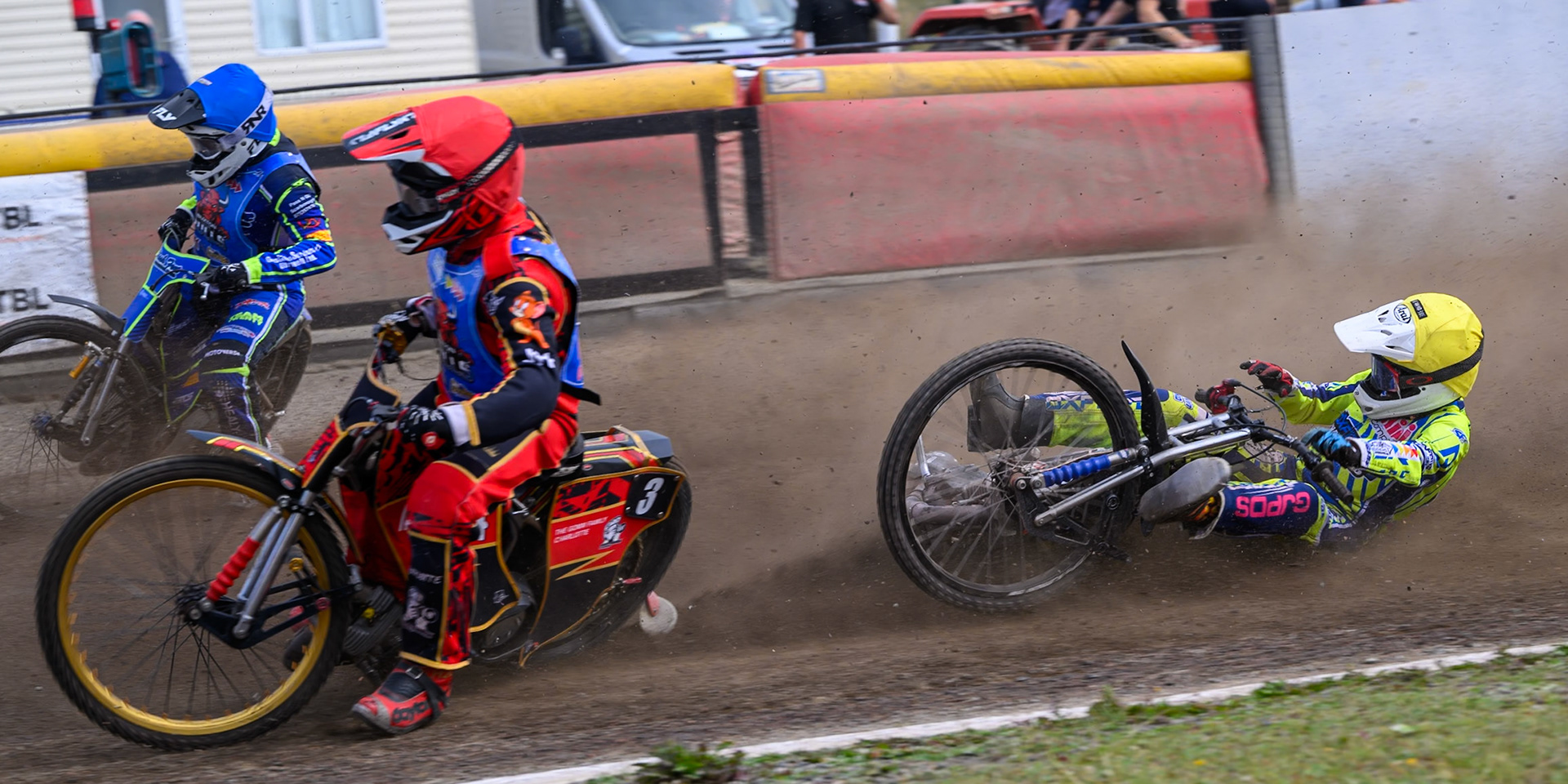 Harry Fletcher of Oxford Chargers in Yellow  falls behind Luke Harris of Buxton Bulls in Red  and Arran Butcher of Buxton Bulls in Blue  during the WSRA National Development League match between Buxton Bulls and Oxford Chargers at Hi-Edge Speedway, Buxton on Sunday 2nd August 2026. (Photo: Ian Charles | MI News)