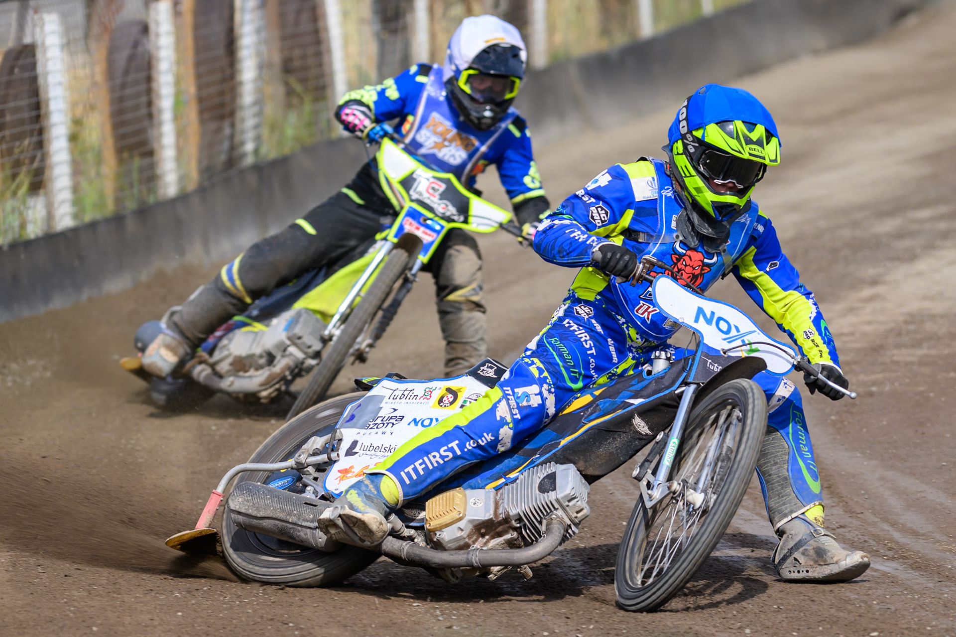 Will Boraston of Buxton Bulls in Blue leading Dylan Huthwaite, Guest Rider for Kings Lynn Young Stars in White during the WSRA National Development League match between Buxton Bulls and King's Lynn Young Stars at Hi-Edge Speedway, Buxton on Sunday 9th August 2026. (Photo: Ian Charles | MI News)