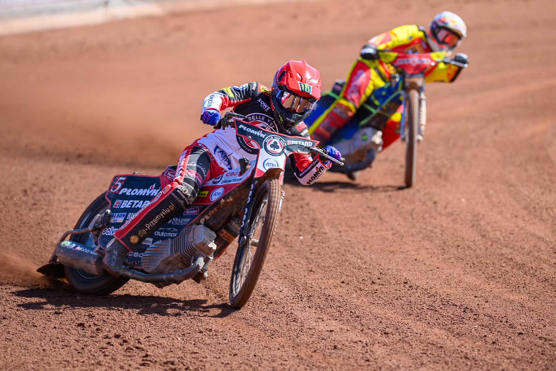 Dan Bewley  of Belle Vue Aces in Red leading Nick Morris of Leicester Lions in White during the Knockout Cup Northern Section match between Belle Vue Aces and Leicester Lions at the National Speedway Stadium, Manchester on Monday 6th April 2026. (Photo: Ian Charles | MI News)