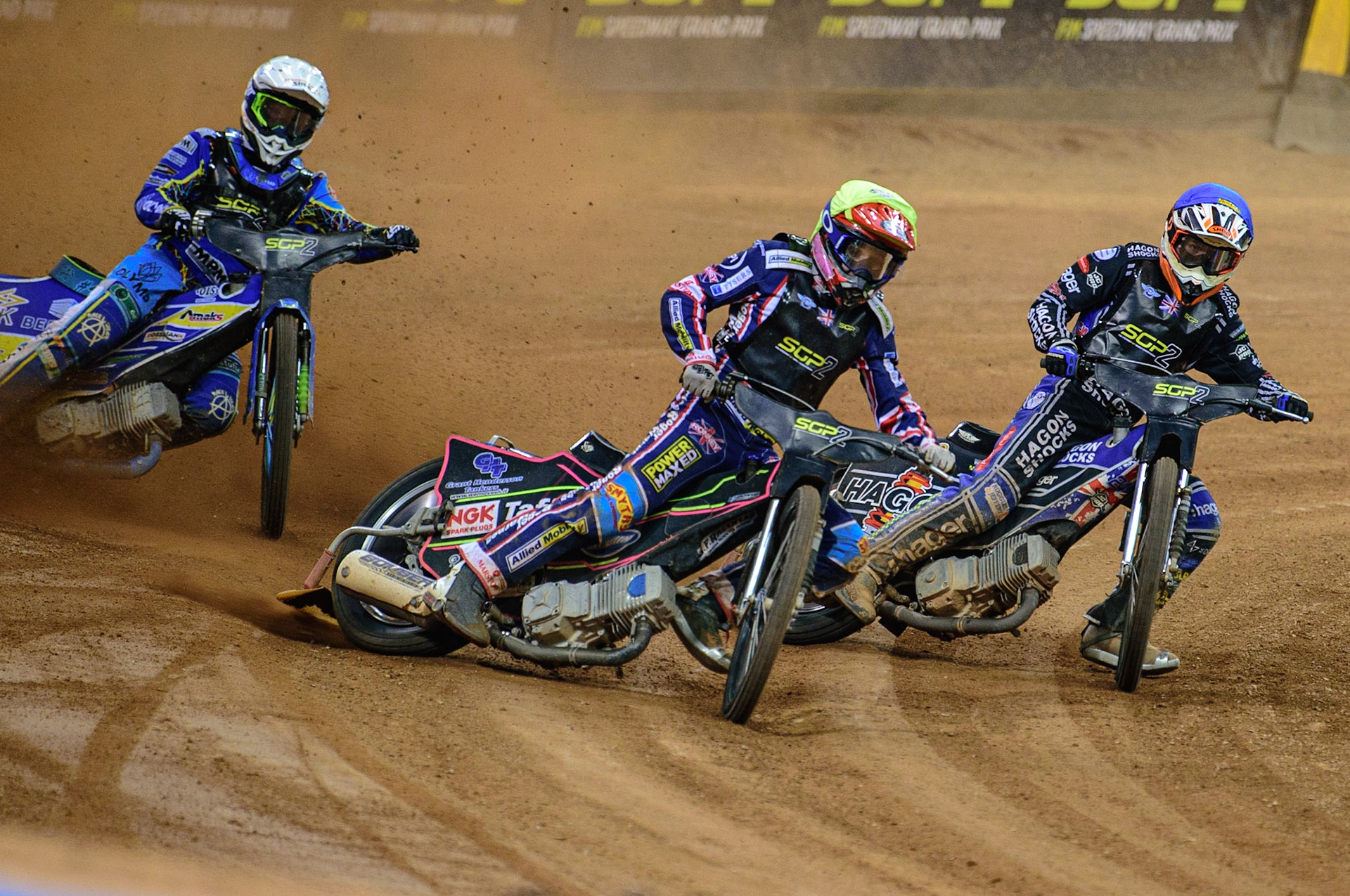 Leon Flint (Great Britain)  (Yellow) leads Jason Edwards (Great Britain) (Blue) and Petr Chlupac (Czech Republic)  (White) during the FIM  Speedway Grand Prix  2 of Great Britain at the Principality Stadium, Cardiff on Sunday 14th August 2022. (Credit: Ian Charles | MI News)
