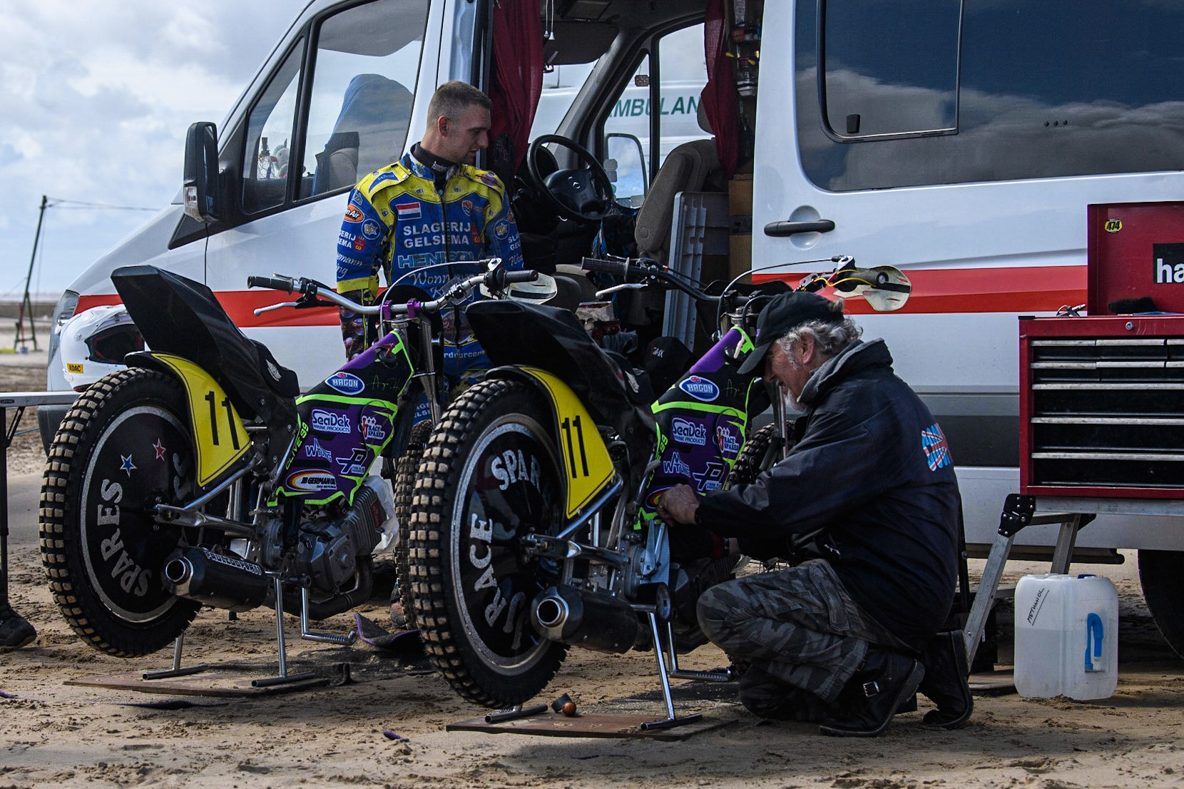 Mechanic works on bikes belonging to Paul Cooper (11) during the Fylde ACU British Sand Racing Masters Championship at  St Annes on Sea, Lancashire on Sunday 30th July 2023. (Photo: Ian Charles | MI News)