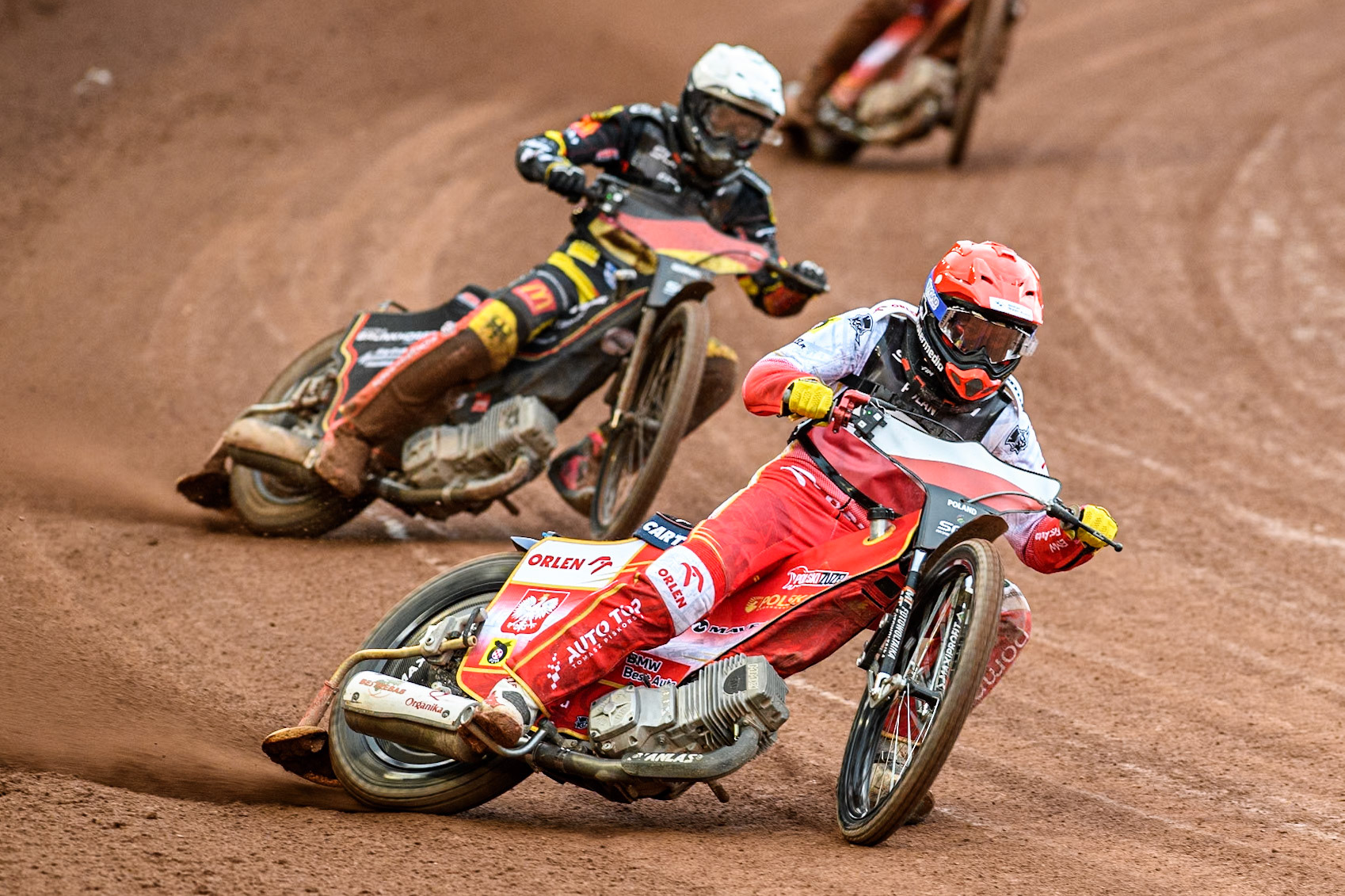 Poland v Germany: Dominik Kubera of Poland in Red leading Kai Huckenbeck of Germany in Red during the Monster Energy FIM Speedway of Nations Semi-Final 1 at the National Speedway Stadium, Manchester on Tuesday 9th July 2024. (Photo: Ian Charles | MI News)
