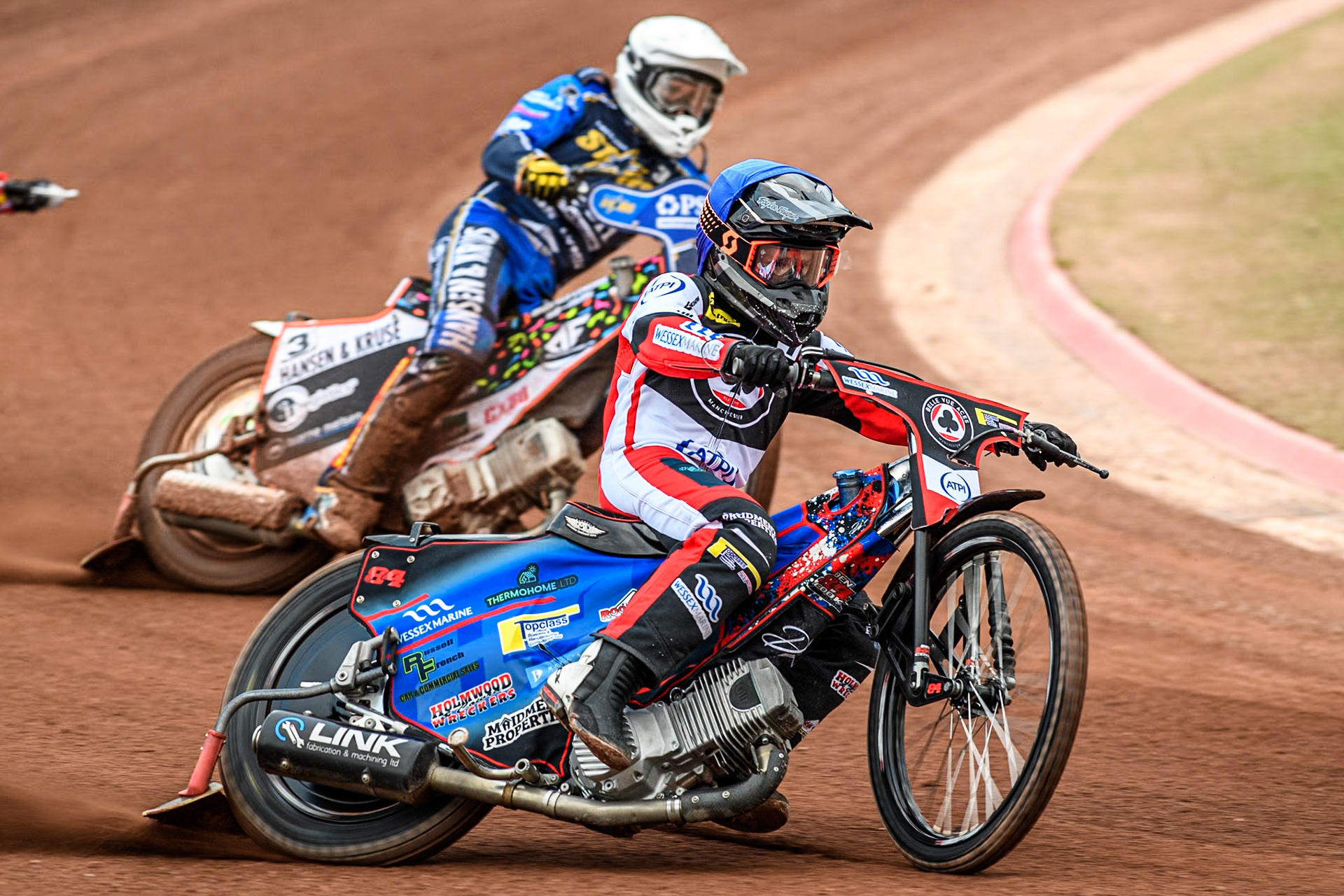 Belle Vue Aces' Ben Cook in Blue leading King Lynn Stars' Niels-Kristian Iversen in White during the Rowe Motor Oil Premiership match between Belle Vue Aces and King's Lynn Stars at the National Speedway Stadium, Manchester on Monday 20th May 2024. (Photo: Ian Charles | MI News)