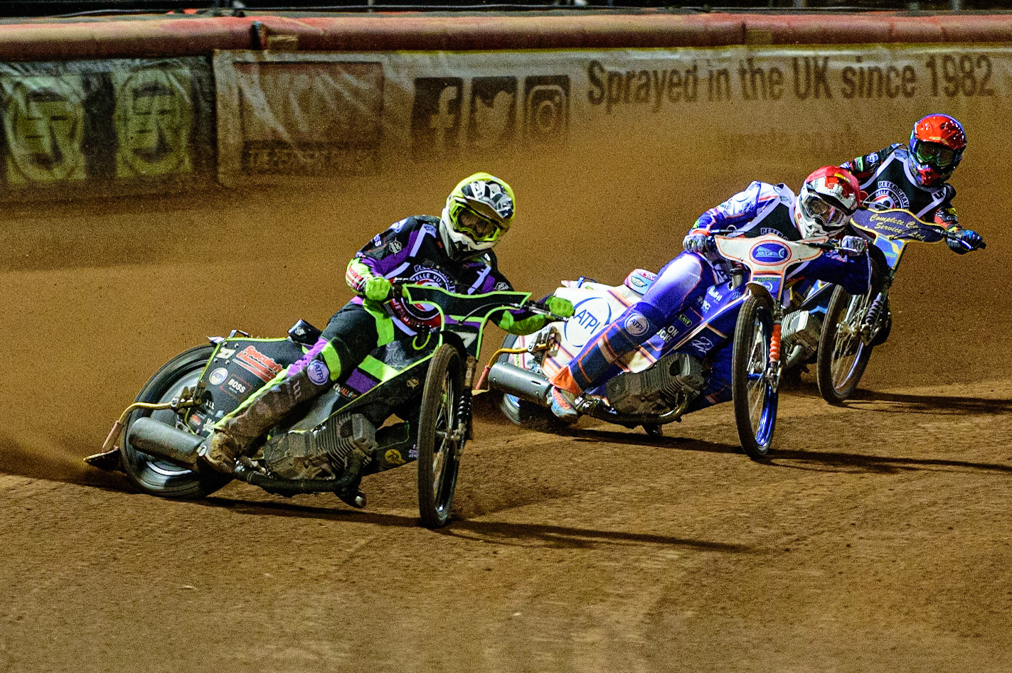 MANCHESTER, UK. OCT 23RD  Tom Brennan  (Yellow) leads Jason Crump  (Red) and Kyle Howarth  (Blue) during the Peter Craven Memorial Trophy event at the National Speedway Stadium, Manchester on Saturday 23rd October 2021. (Credit: Ian Charles | MI News)