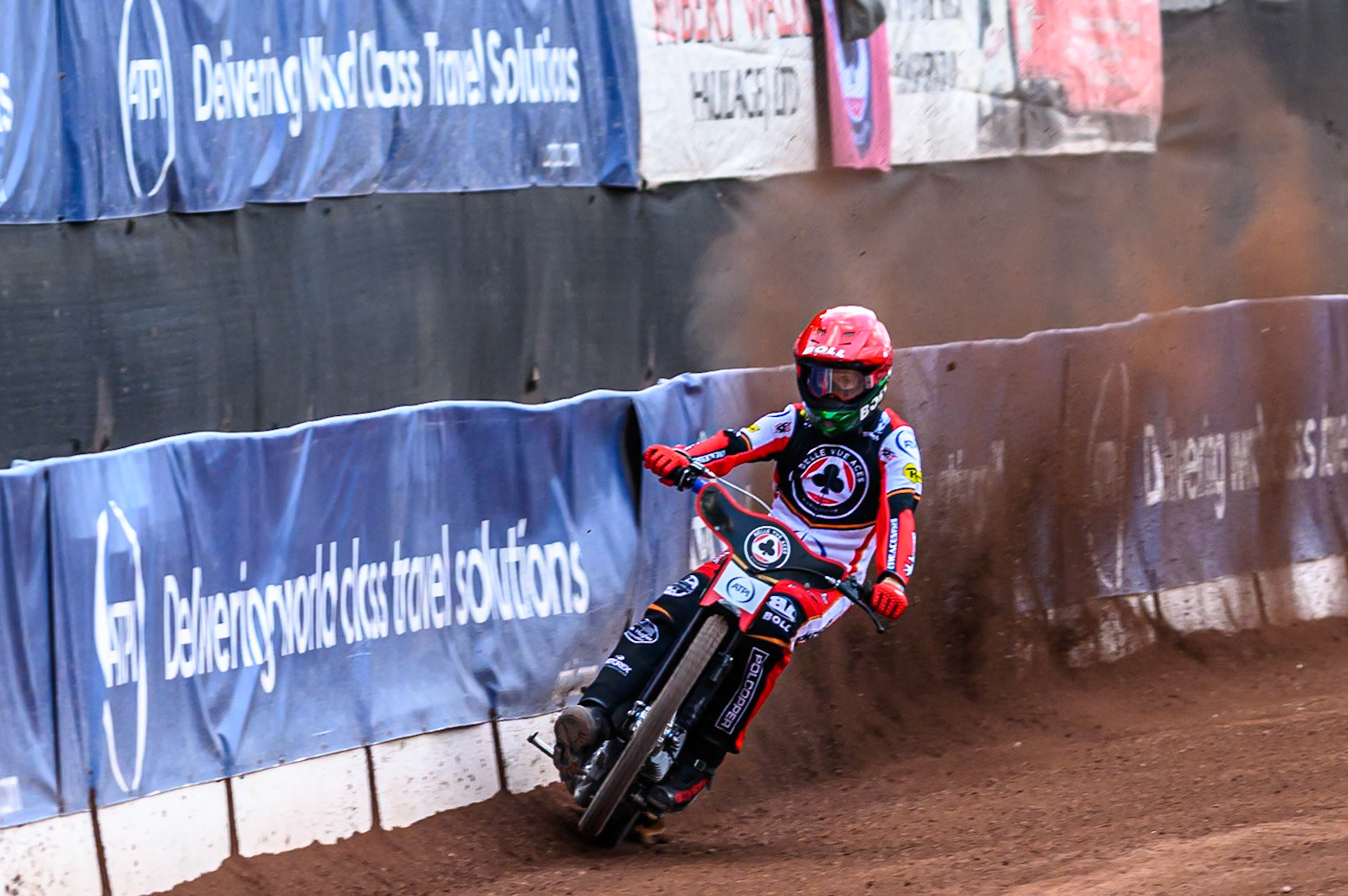Belle Vue Aces' Brady Kurtz picks up some drive as he uses the dirt build up on the safety fence during the Rowe Motor Oil Premiership match between Belle Vue Aces and King's Lynn Stars at the National Speedway Stadium, Manchester on Monday 23rd June 2025. (Photo: Ian Charles | MI News)