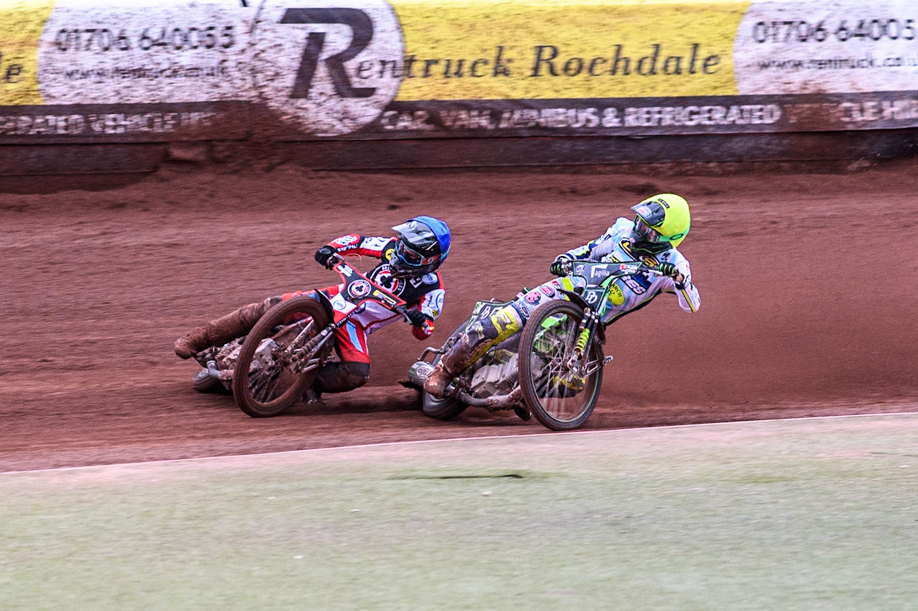 Belle Vue Aces' Ben Cook in Blue loses control after a tangle with Oxford Spires' Charles Wright in Yellow during the Rowe Motor Oil Premiership match between Belle Vue Aces and Oxford Spires at the National Speedway Stadium, Manchester on Monday 22nd July 2024. (Photo: Ian Charles | MI News)