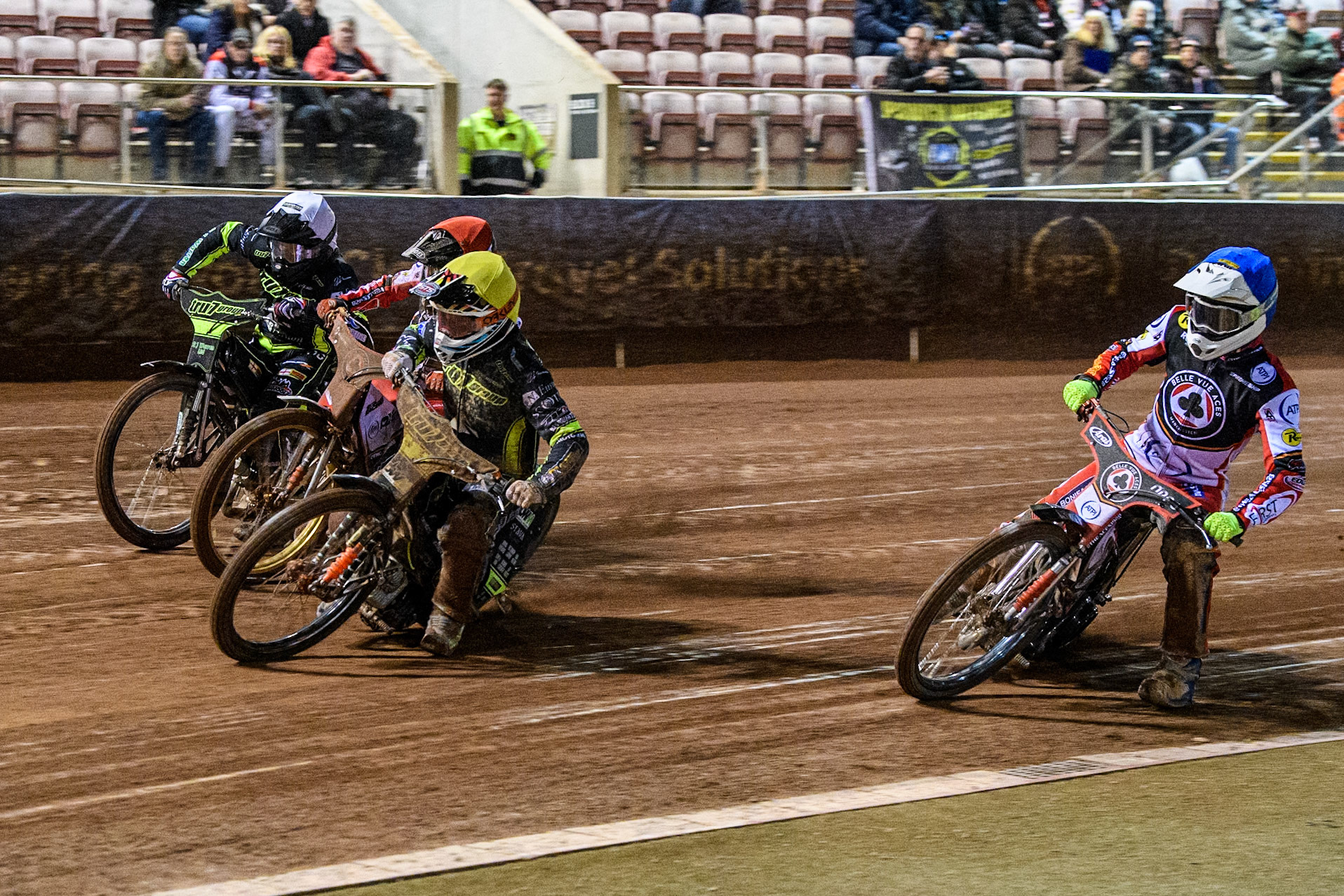 Jordan Jenkins of Ipswich Witches in Yellow leading Norick Blödorn of Belle Vue Aces in Red Danny King of Ipswich Witches in White with Jake Mulford of Belle Vue Aces behind during the Premiership Cup Quarter Final 1st Leg match between Belle Vue Aces and Ipswich Witches at the National Speedway Stadium, Manchester on Monday 24th March 2025. (Photo: Ian Charles | MI News)