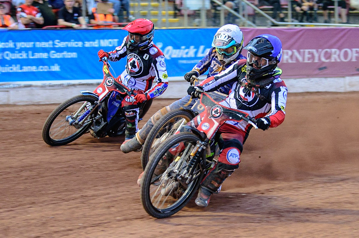 MANCHESTER UK  Tom Brennan  (Blue) leads Richard Lawson  (White) and Matej Zagar  (Red) during the SGB Premiership match between Belle Vue Aces and King's Lynn Stars at the National Speedway Stadium, Manchester on Monday 11th July 2022. (Credit: Ian Charles | MI News)