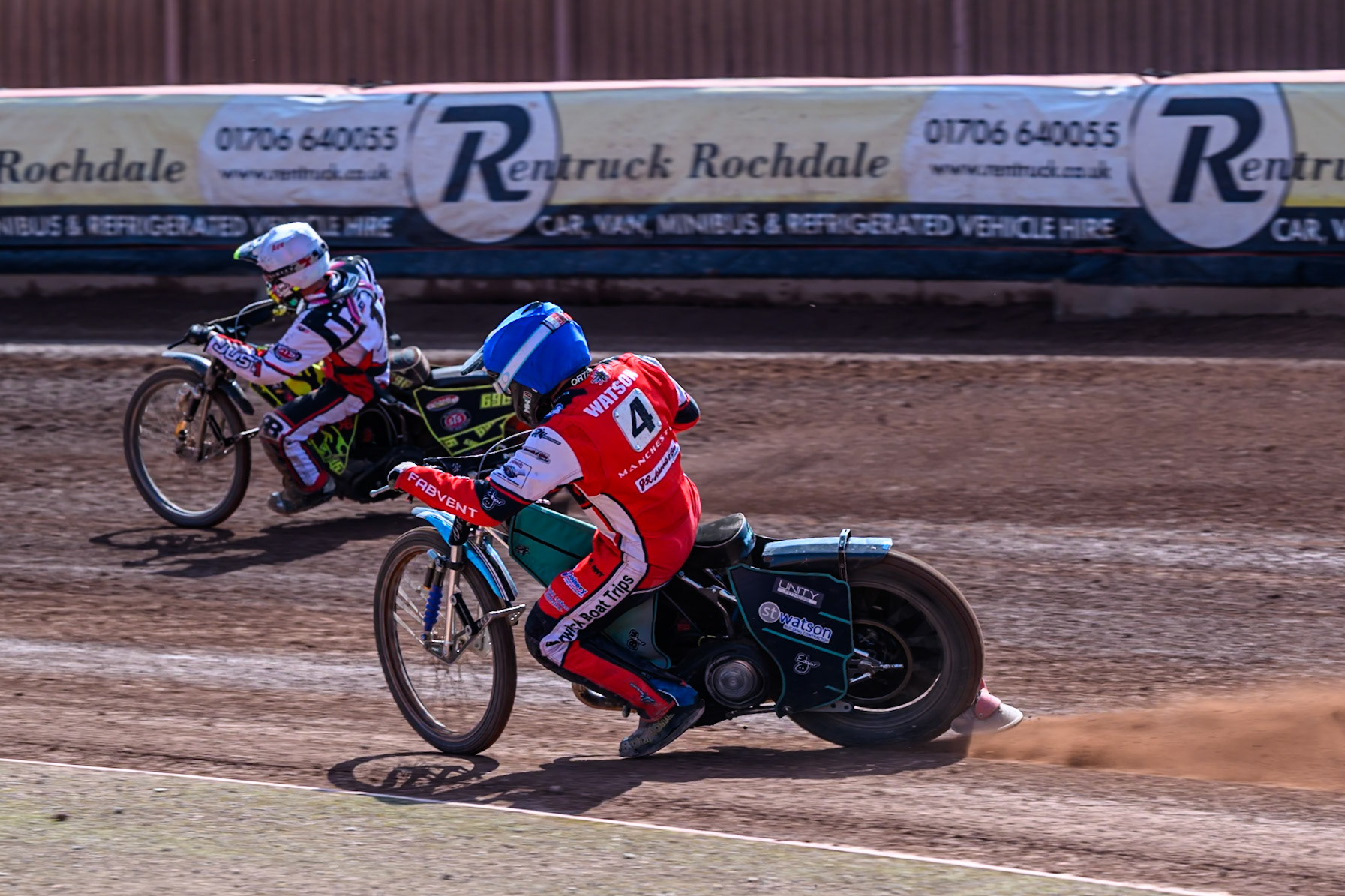 Mason Watson of Belle Vue Colts  in Blue chases Ace Pijper of Middlesborough Tigers  in White during the WSRA National Development League match between Belle Vue Colts and Middlesbrough Tigers at the National Speedway Stadium, Manchester on Sunday 10th August 2025. (Photo: Mark Fletcher | MI News)