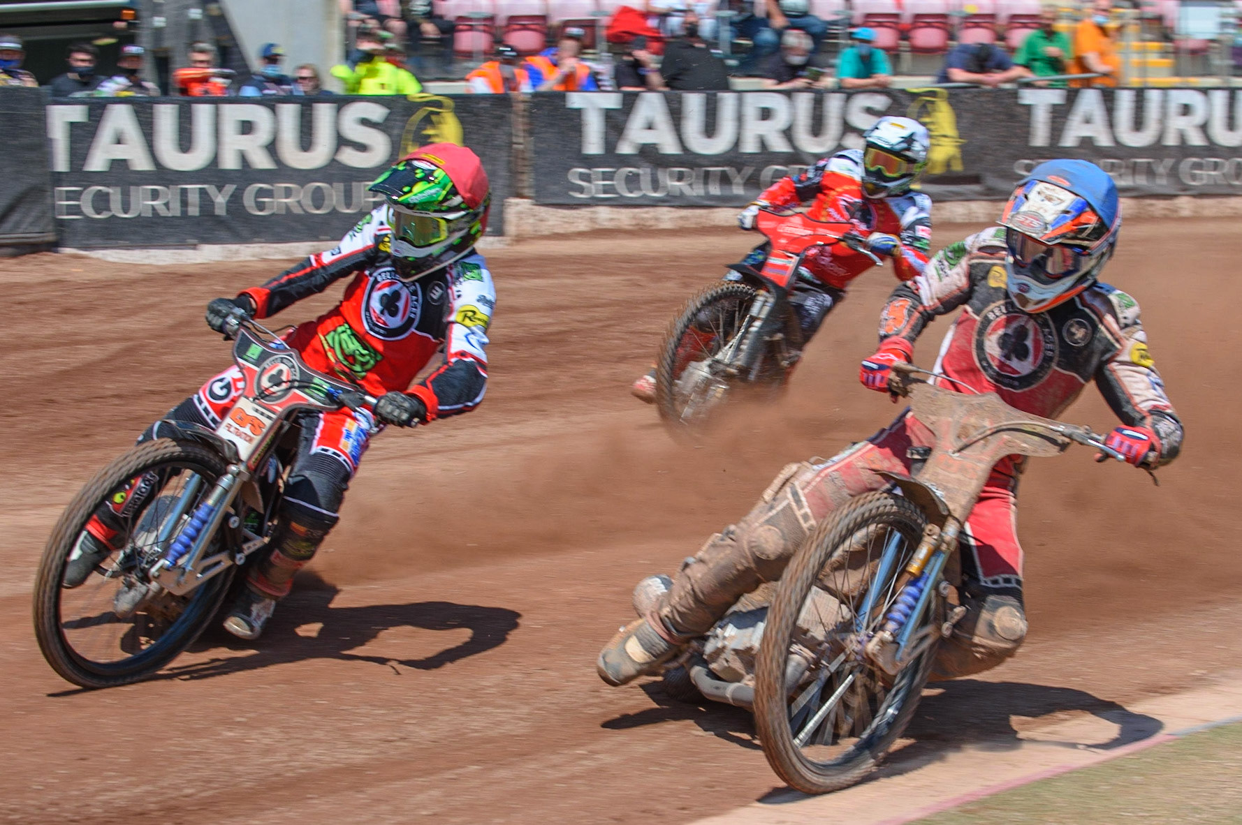 MANCHESTER, UK. MAY 31ST  Dan Bewley  (Red) and Steve Worrall  lead Chris Harris  (White) in the rerun of Heat9 during the SGB Premiership match between Belle Vue Aces and Peterborough at the National Speedway Stadium, Manchester on Monday 31st May 2021. (Credit: Ian Charles | MI News)