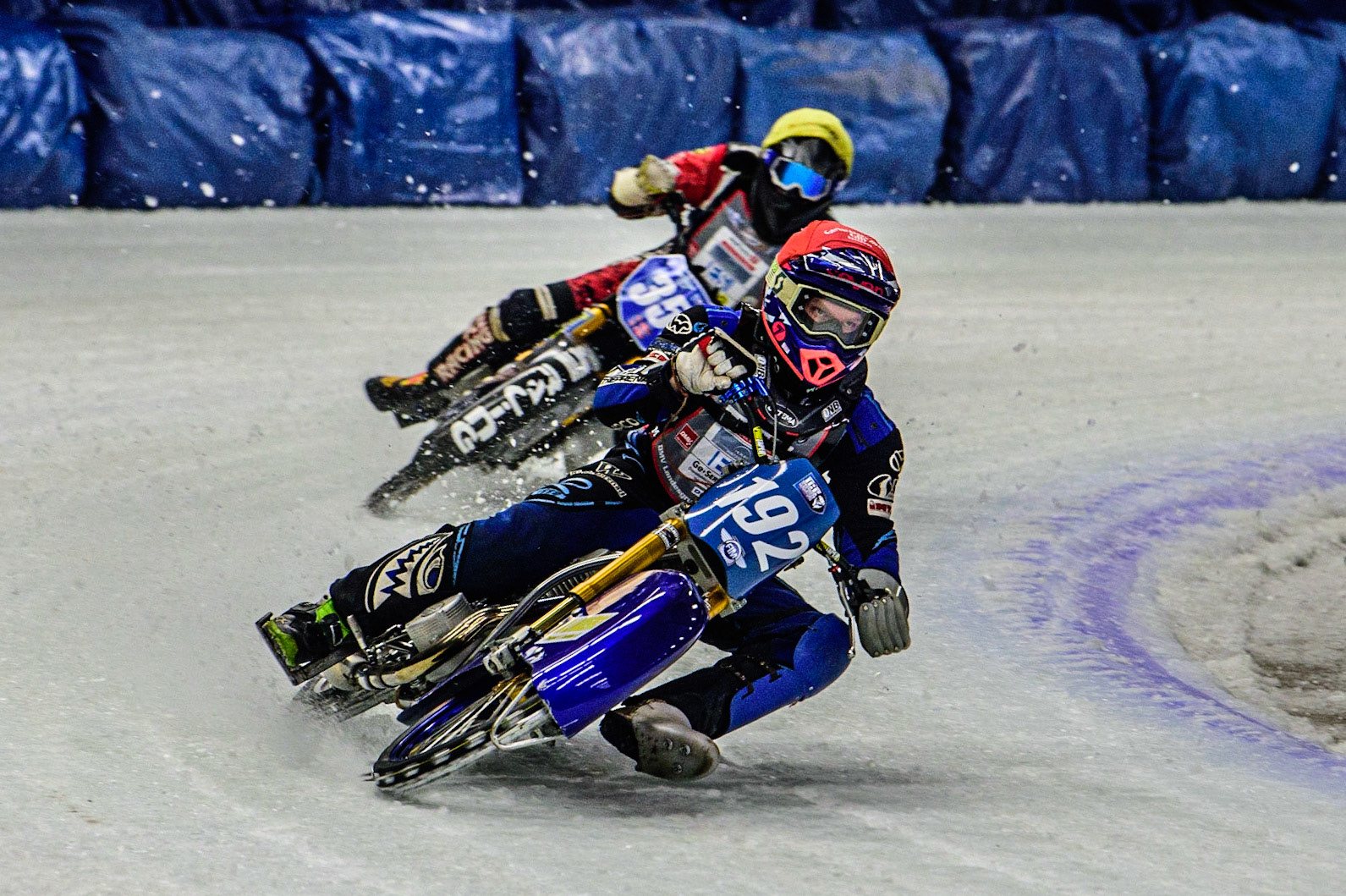 Niclas Svensson (192) (Red) leads Jo Saetre (357) (Yellow) during the Ice Speedway Gladiators World Championship Final 1 at Max-Aicher-Arena, Inzell, Germany on Saturday 18th March 2023. (Photo: Ian Charles | MI News)