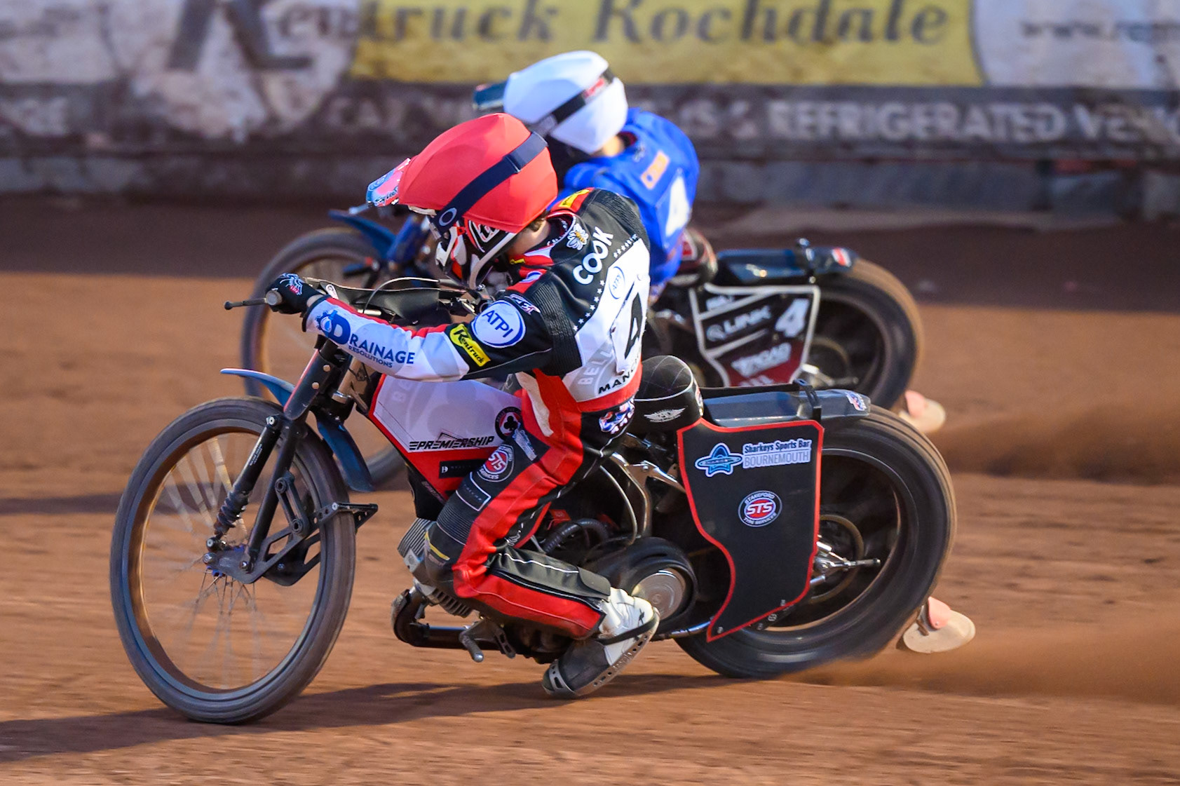 Zach Cook of Belle Vue Aces in Red rides inside Ben Cook of Kings Lynn Stars in White during the Rowe Motor Oil Premiership match between Belle Vue Aces and King's Lynn Stars at the National Speedway Stadium, Manchester on Monday 10th August 2026. (Photo: Ian Charles | MI News)