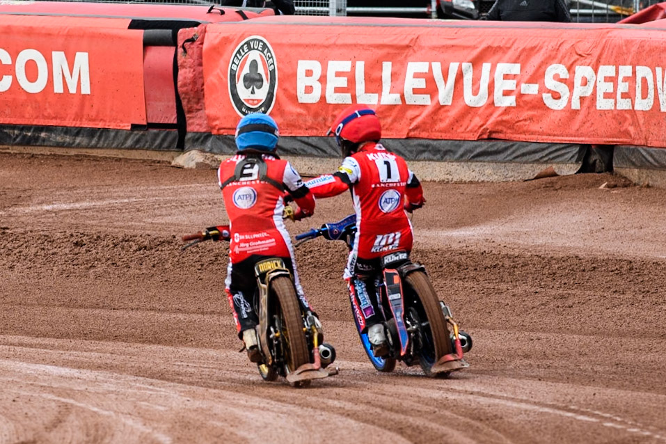 Belle Vue Aces' Norick Blodorn  in Blue and Belle Vue Aces' Brady Kurtz  celebrate their maximum points heat win during the Rowe Motor Oil Premiership match between Belle Vue Aces and Ipswich Witches at the National Speedway Stadium, Manchester on Monday 1st July 2024. (Photo: Ian Charles | MI News)