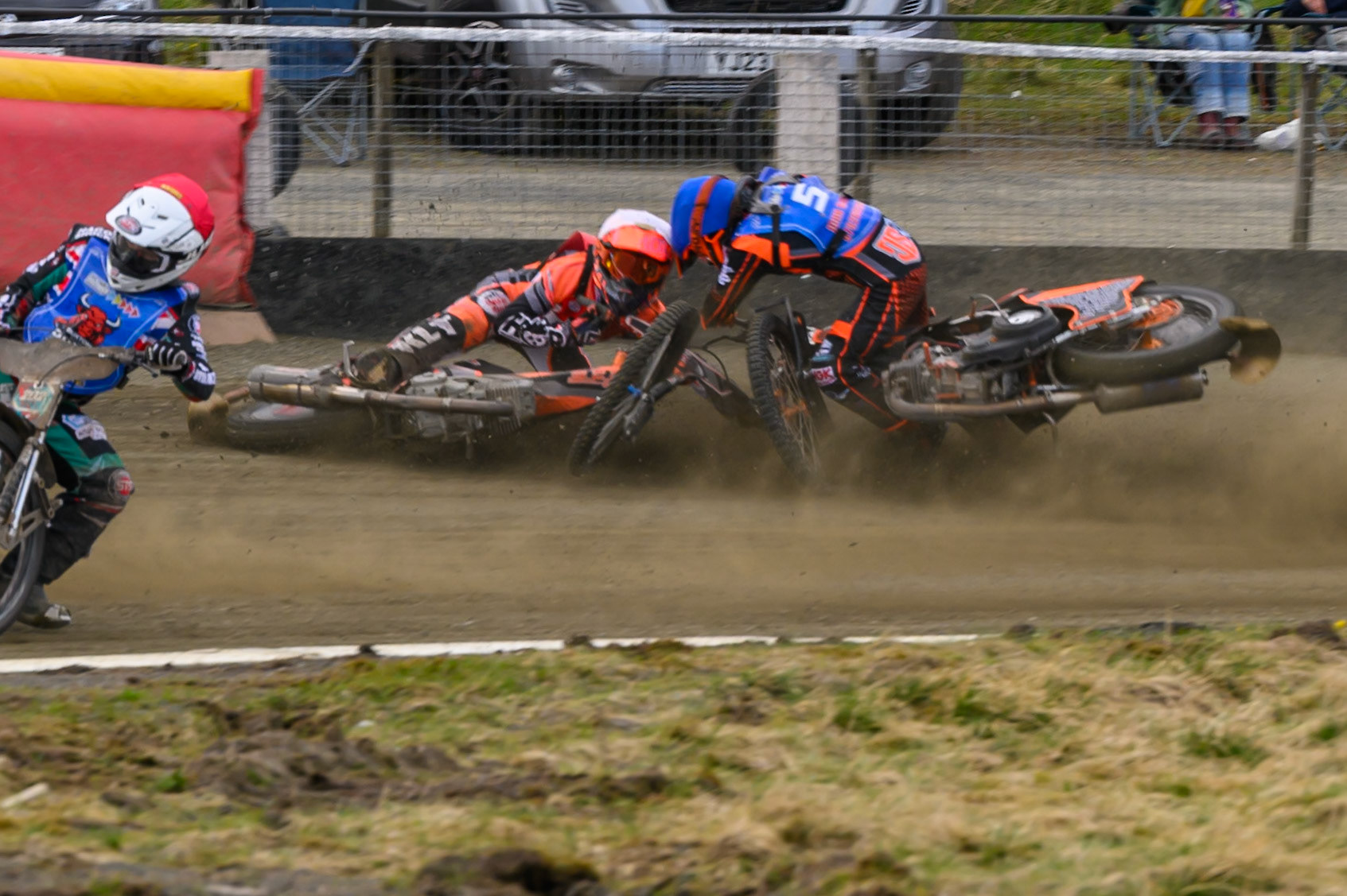Connor Coles of NDL Nomads   in White fall and Jack Smith of Buxton Bulls   in Blue collides with him during the  Challenge match between Buxton Bulls and NDL Nomads at Hi-Edge Speedway, Buxton on Sunday 19th April 2026. (Photo: Ian Charles | MI News)